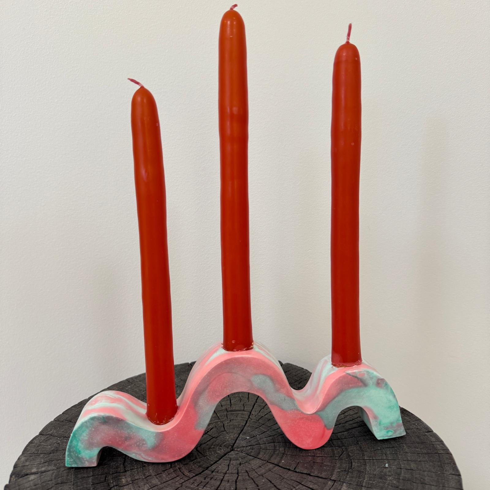 Red and green and gold wavy concrete holder for taper candles