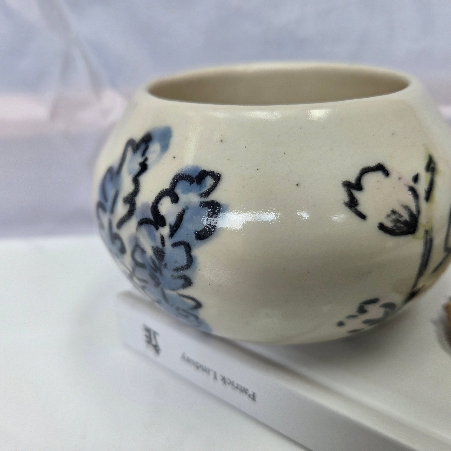 Wheel thrown ceramic Moon Bowl with hand painted flower detail