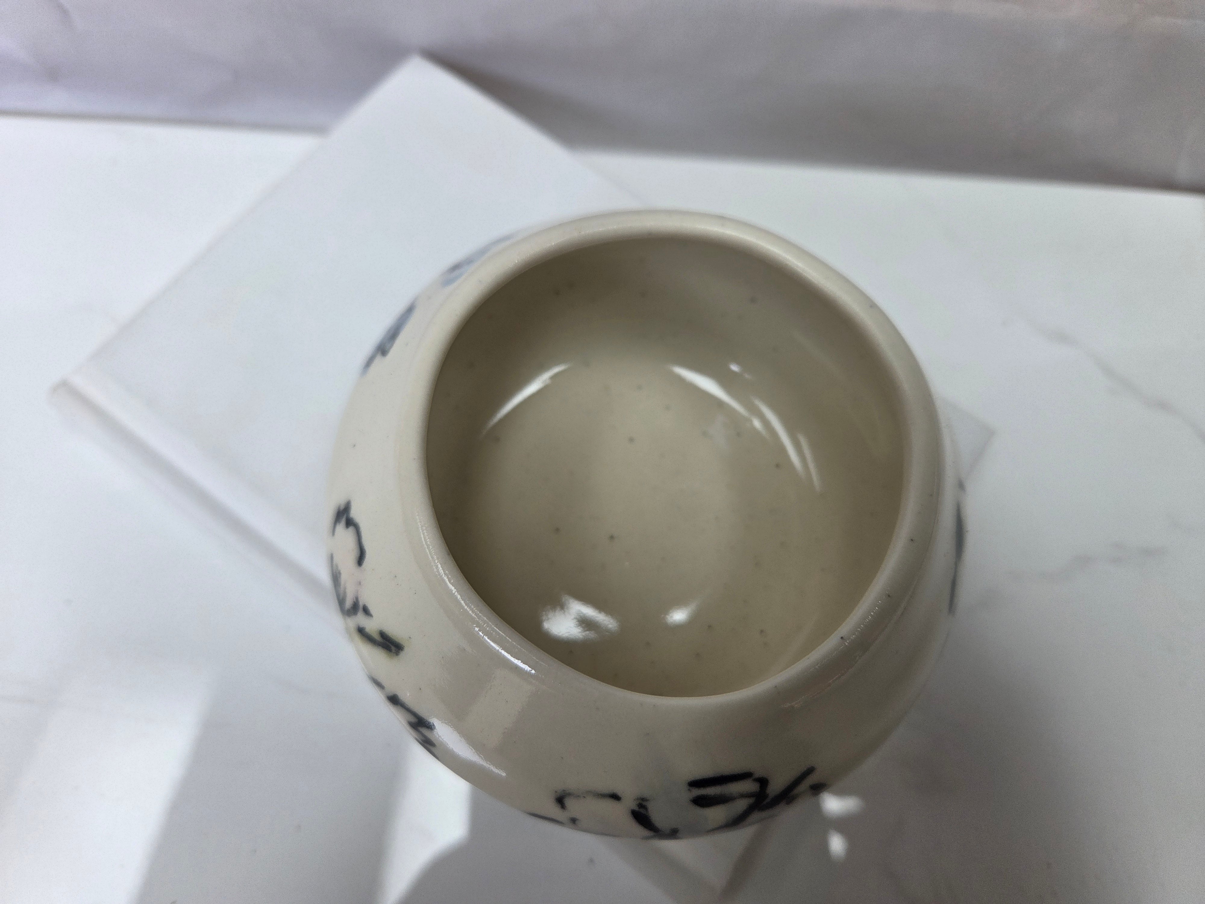 Wheel thrown ceramic Moon Bowl with hand painted flower detail