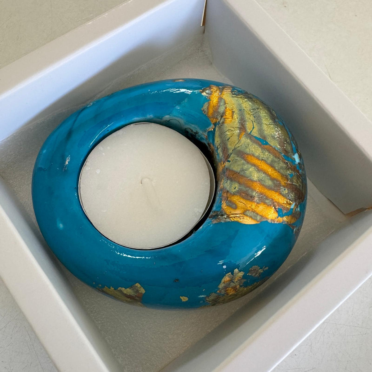 Teal and gold eco-stone pebble shaped tealight candle holder