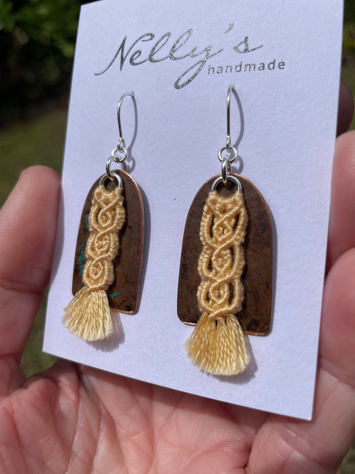 Yellow macrame thread on patinated copper
