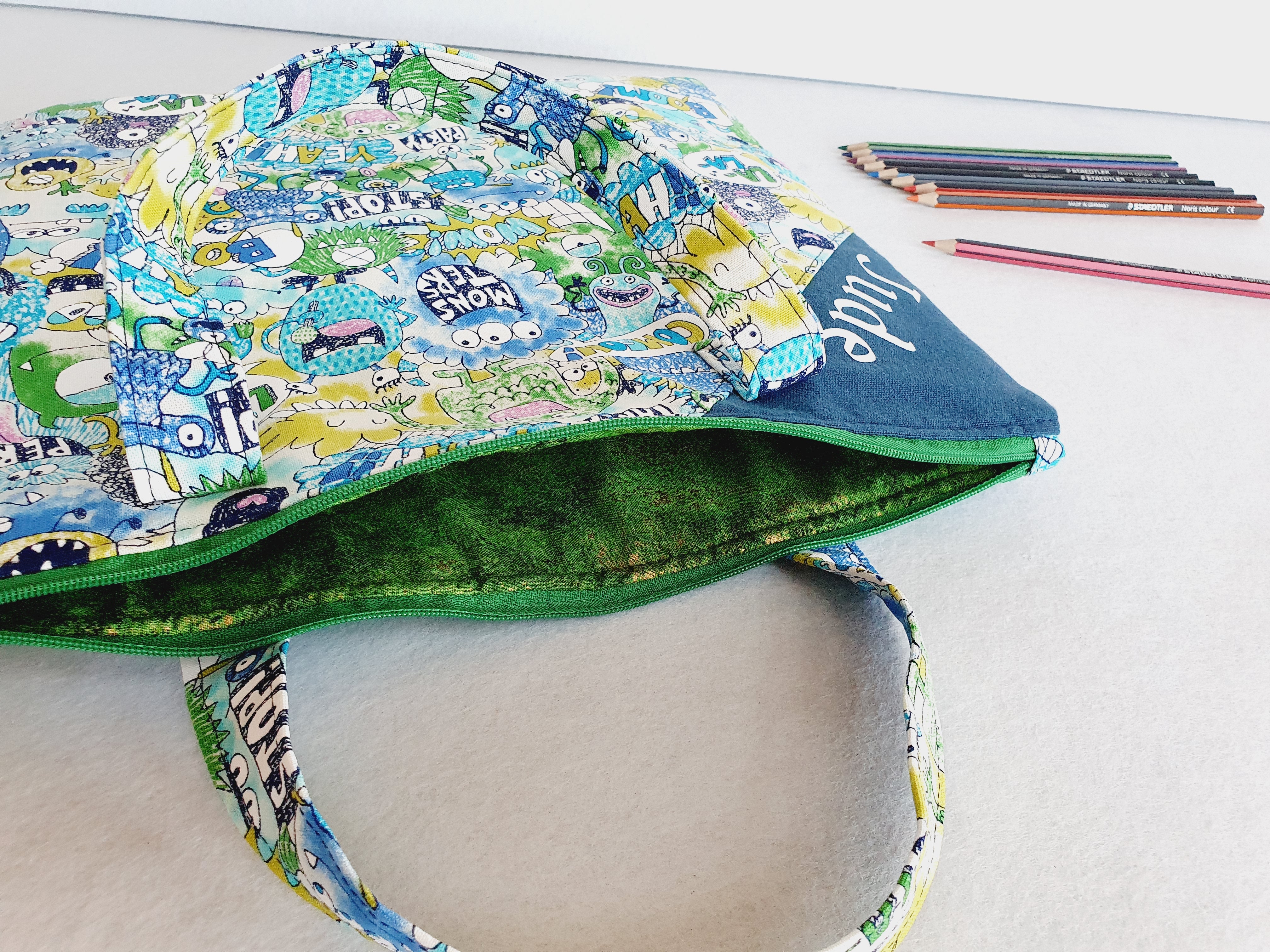 Personalized friendly monsters inspired library and laptop bag with glow-in-the-dark name