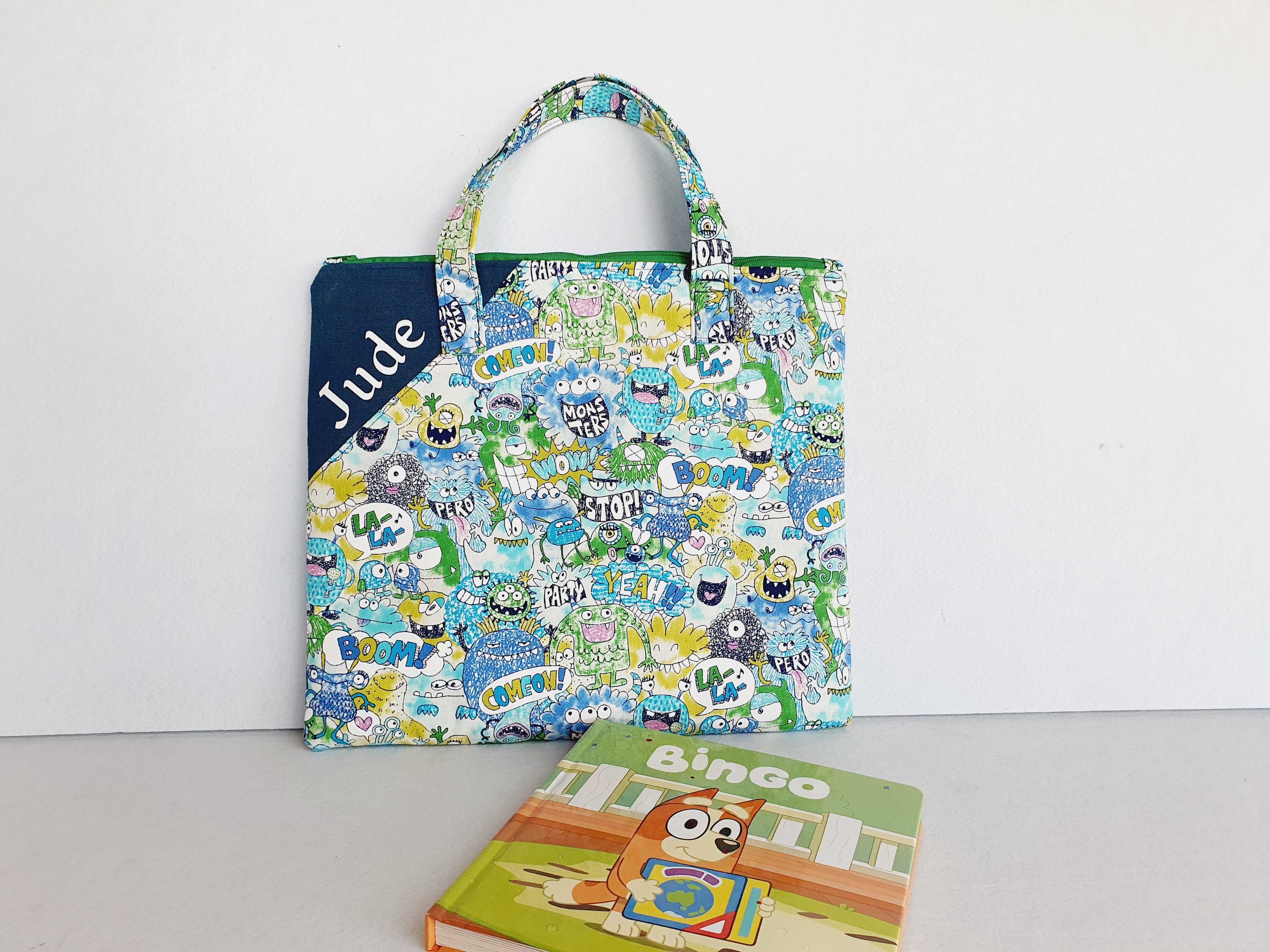 Personalized friendly monsters inspired library and laptop bag with glow-in-the-dark name