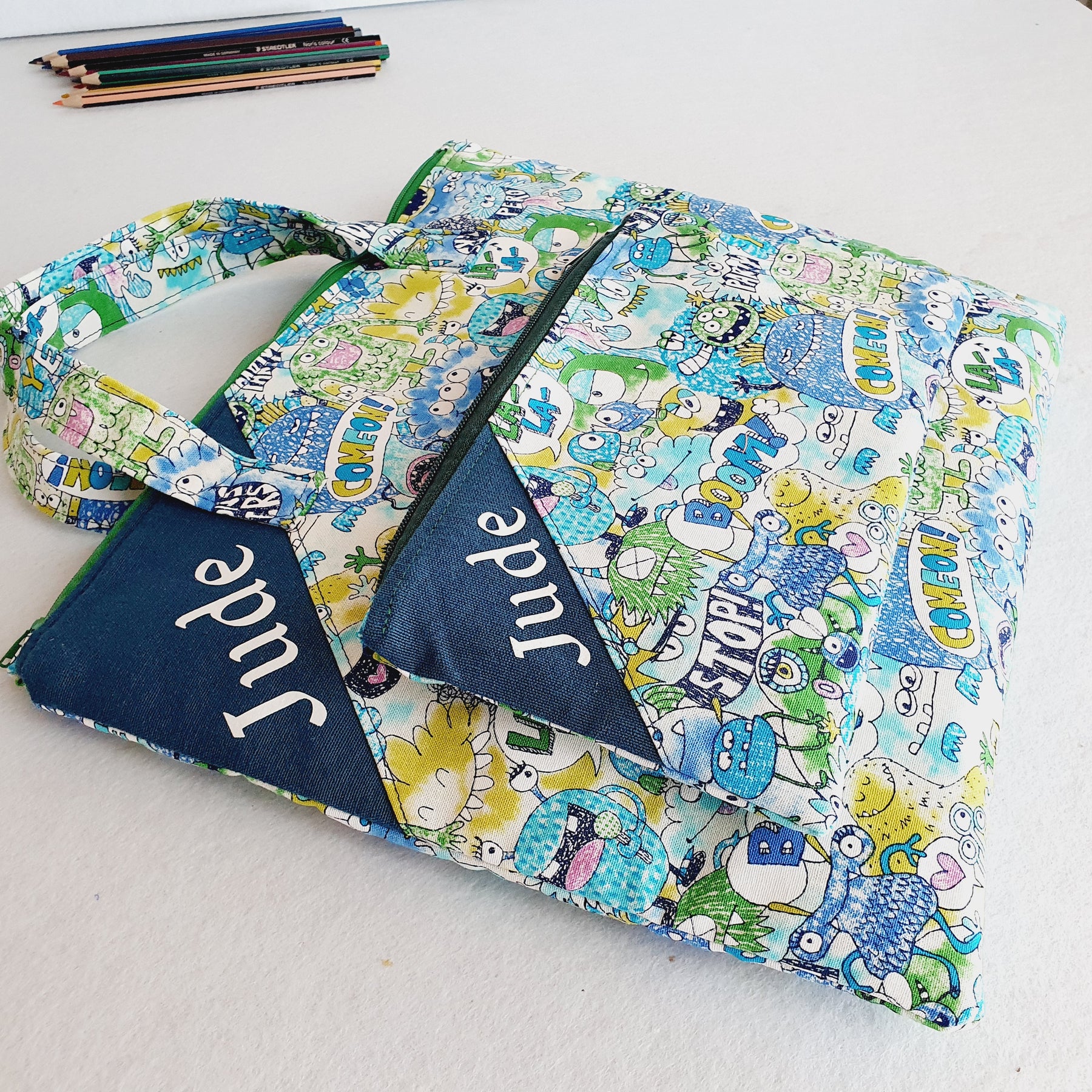 Personalized friendly monsters inspired library and laptop bag with glow-in-the-dark name