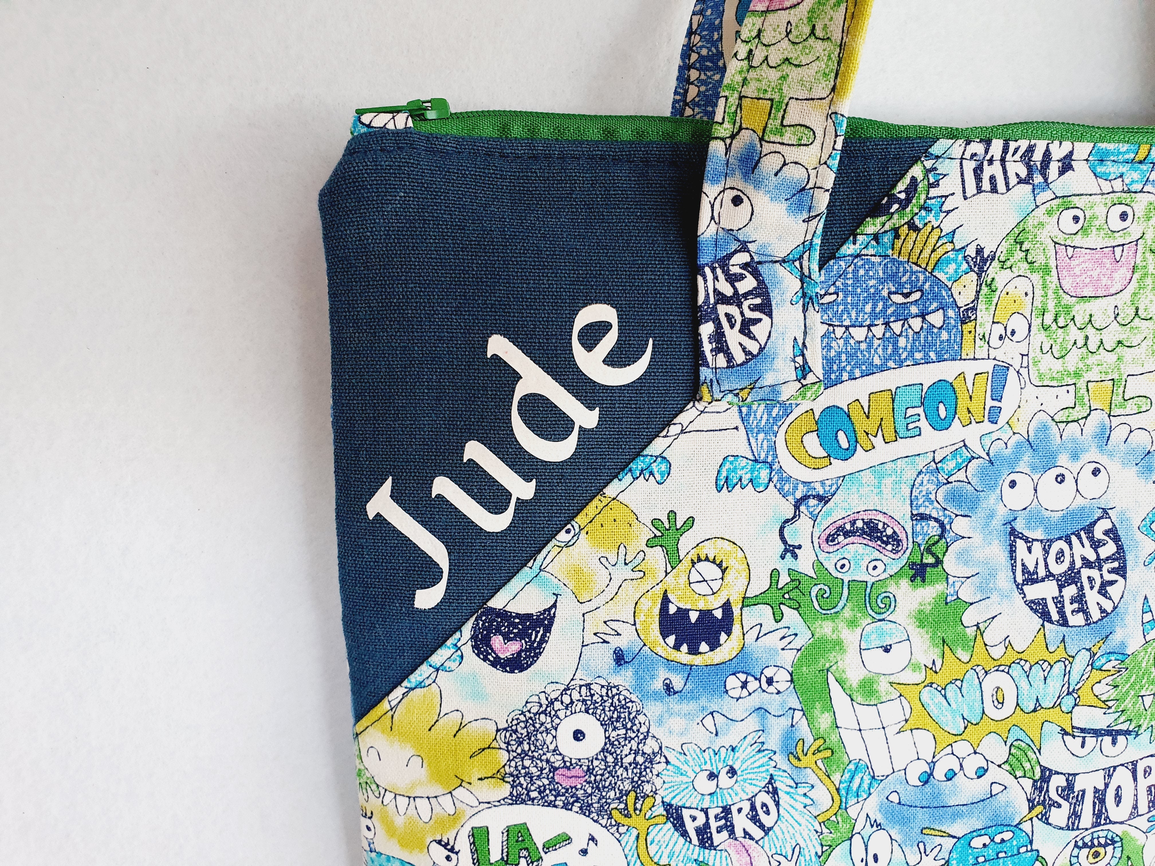 Personalized friendly monsters inspired library and laptop bag with glow-in-the-dark name