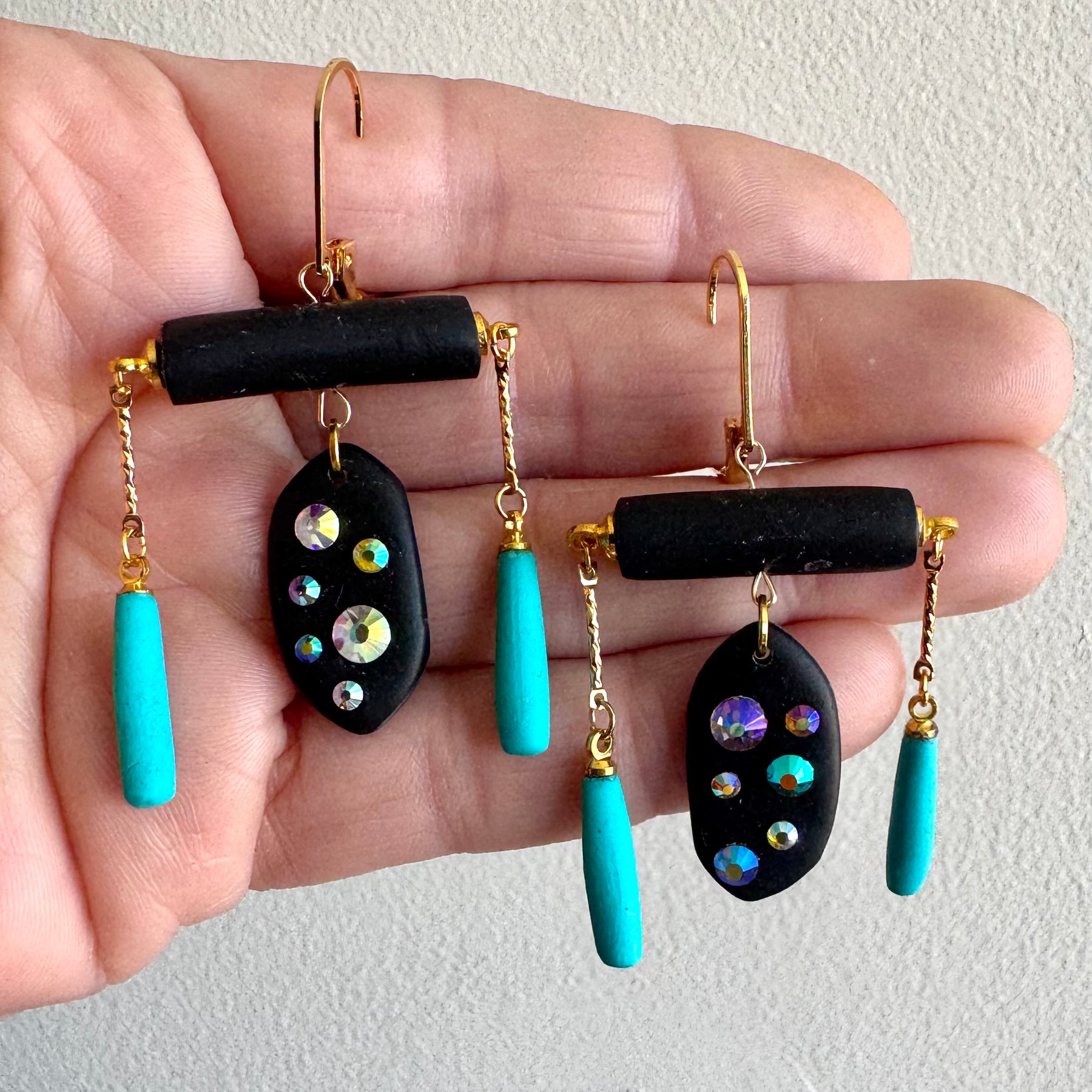 Black rod earrings with holographic gems