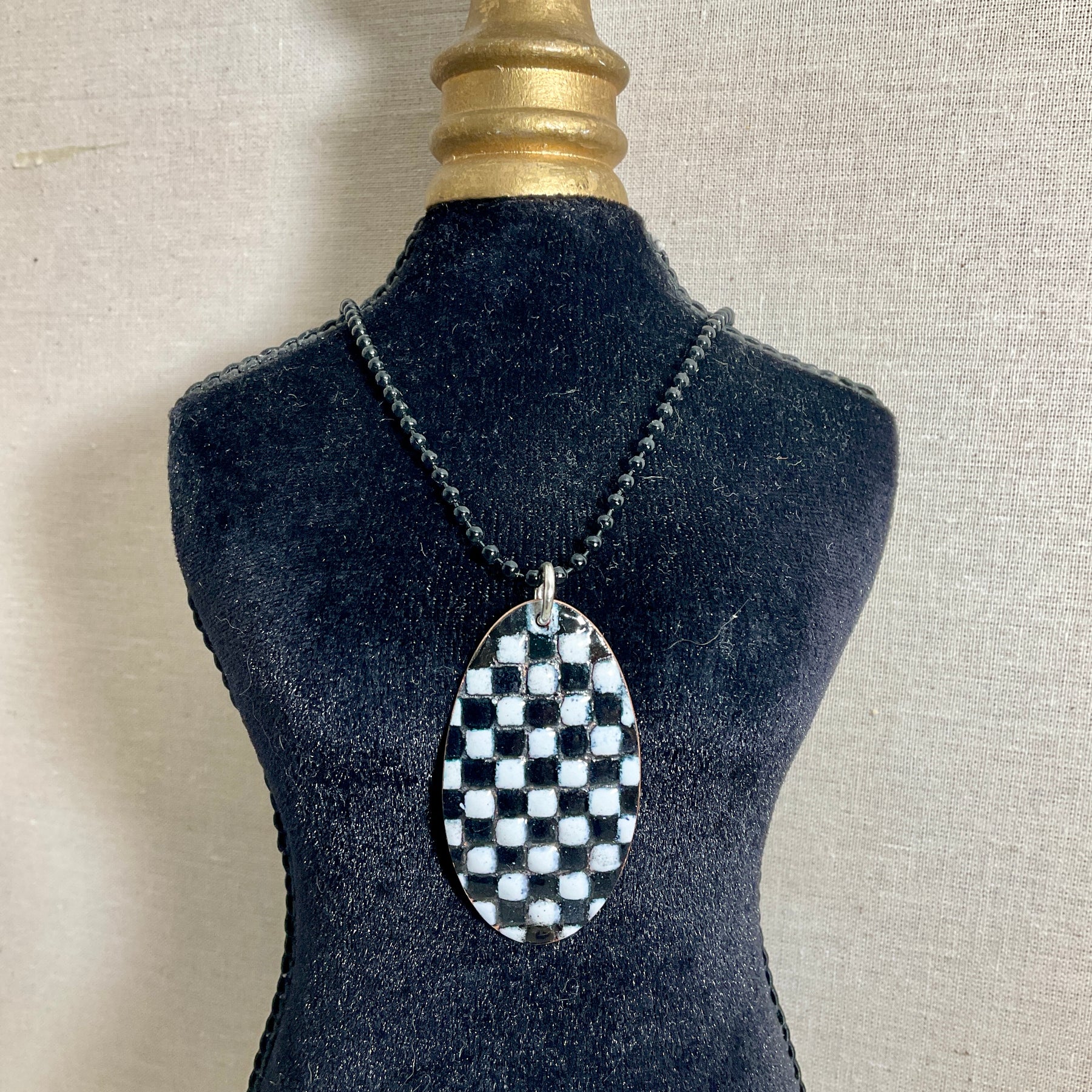 Black and white patchwork enamel pendant. Copper and enamel