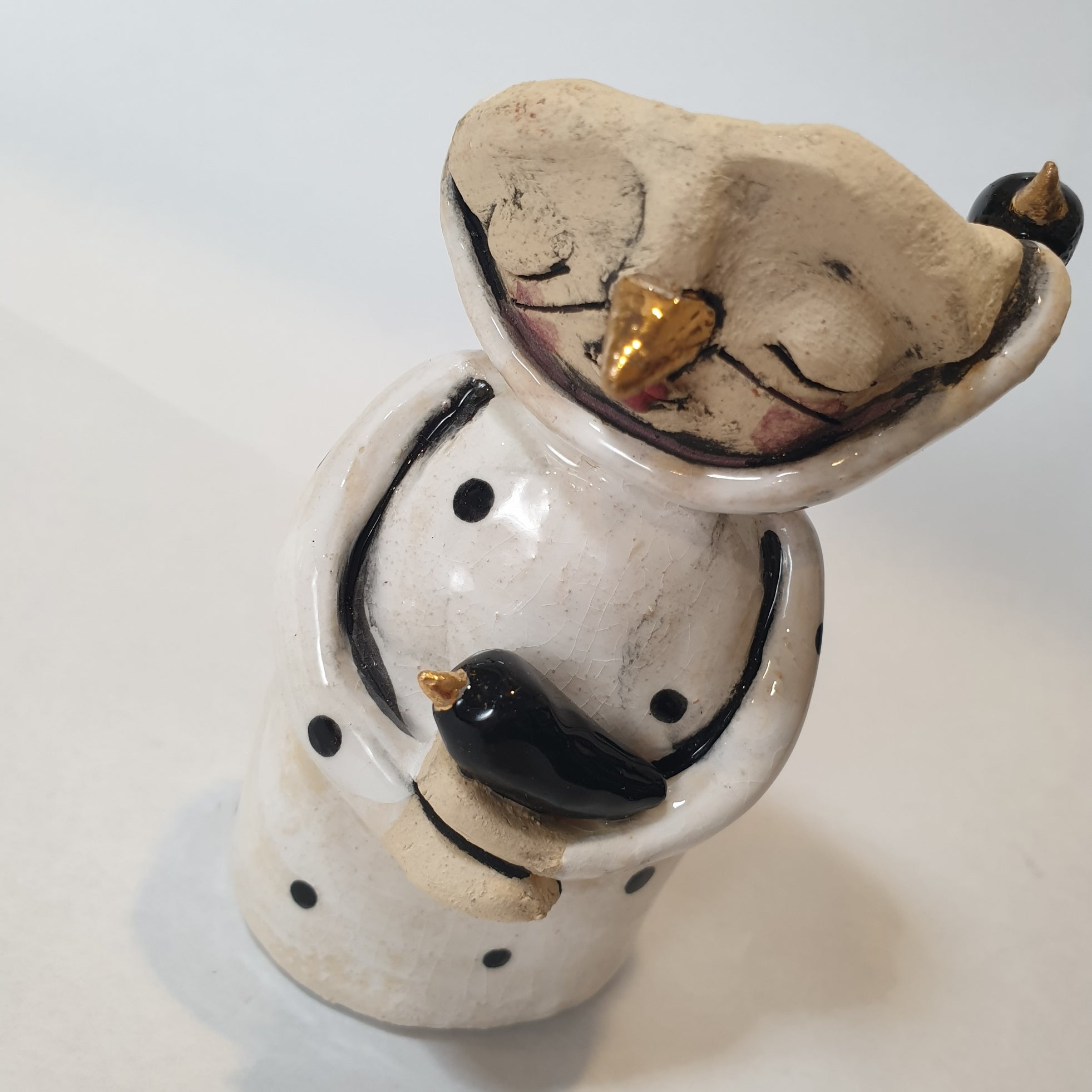 little clay character, birds and dots