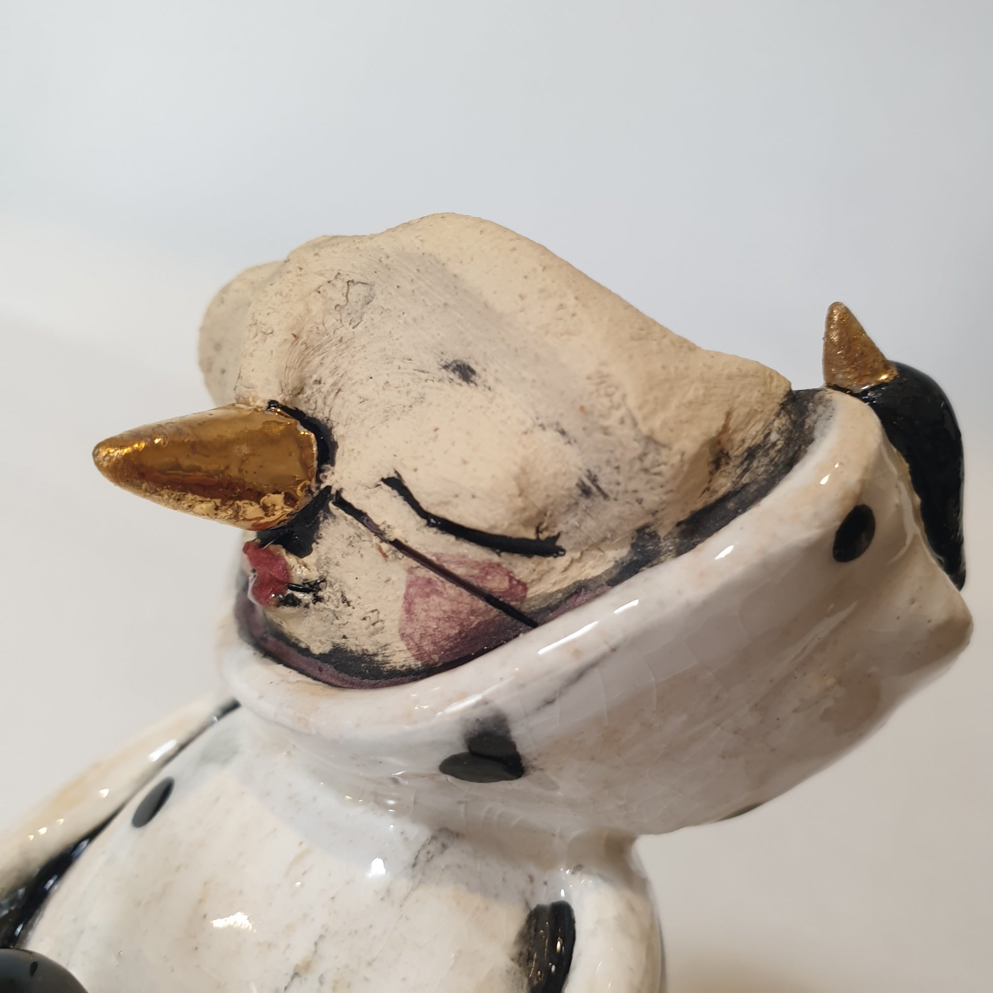 little clay character, birds and dots