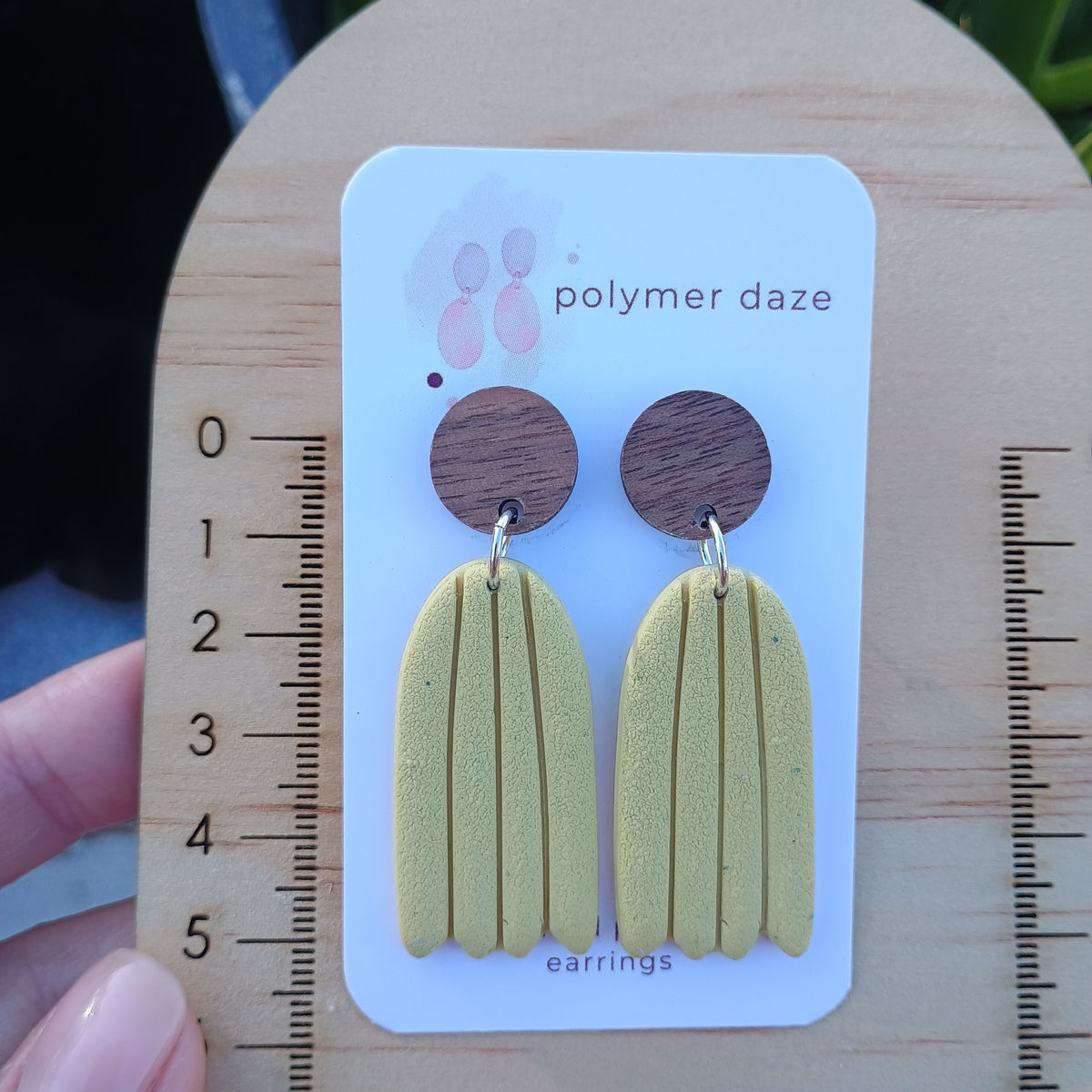 Embossed dangle earrings with natural wood stud