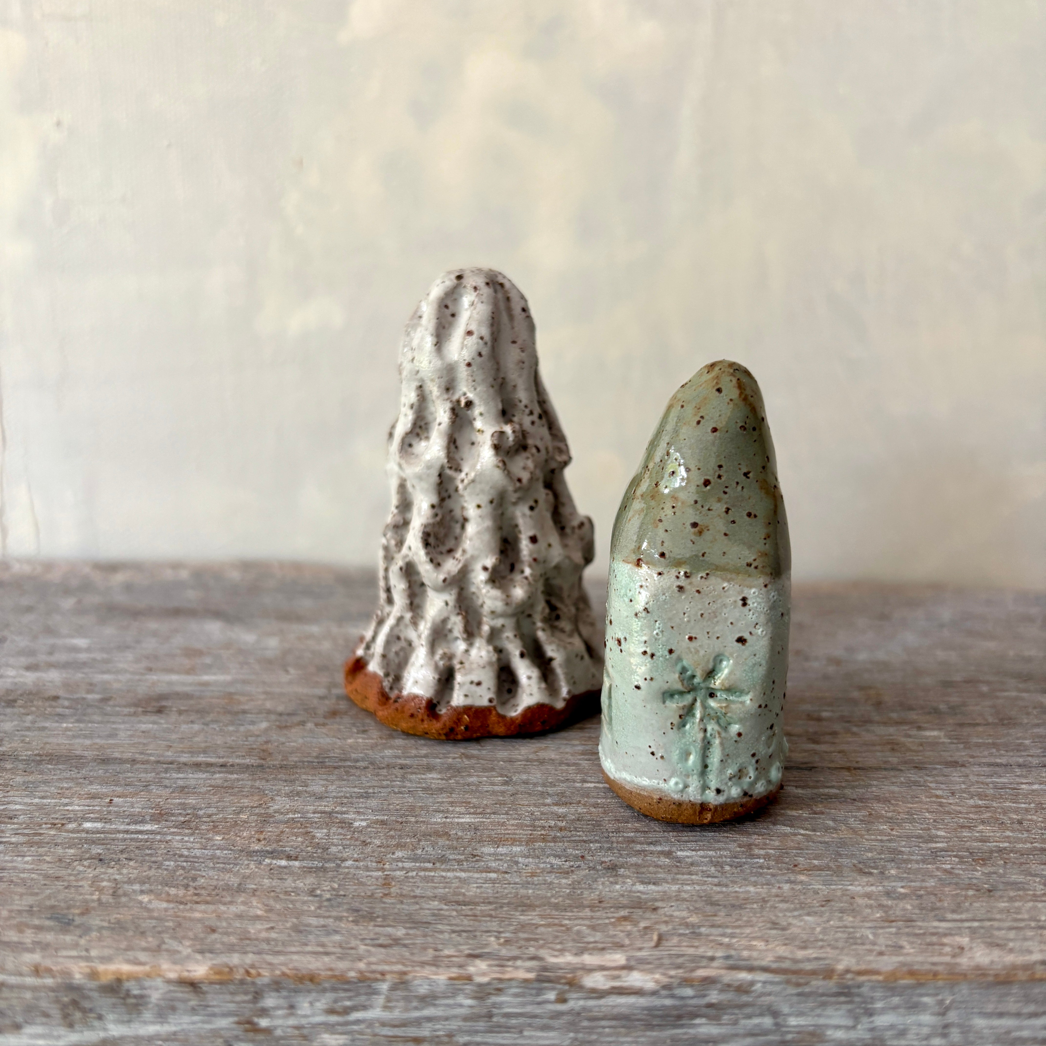 A cute tiny cottage with a little tree