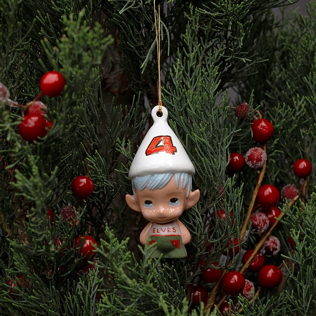 Handmade Porcelain Christmas ornament. One-of-a-kind. Kade the footy Elf.