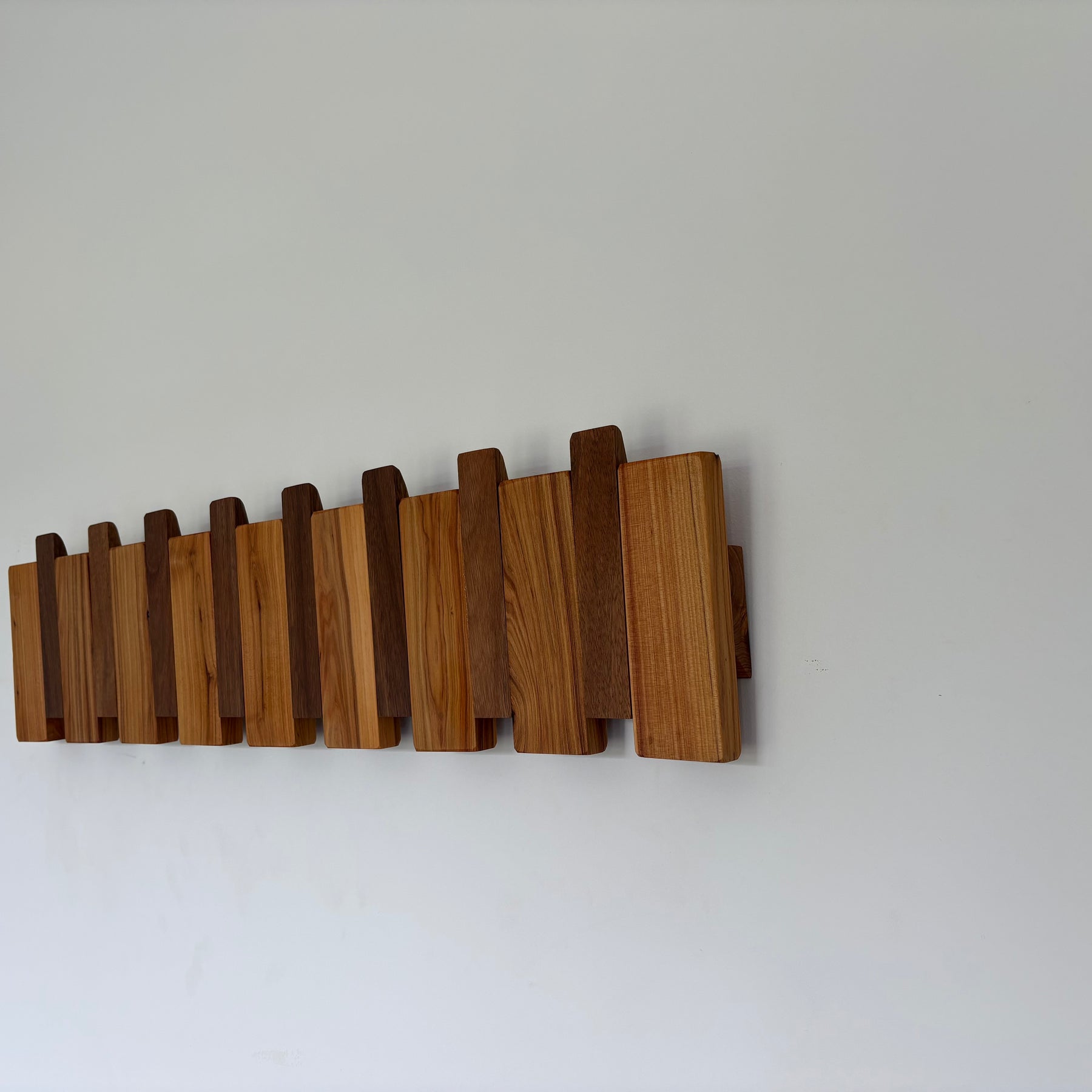 Two tone piano style coatrack