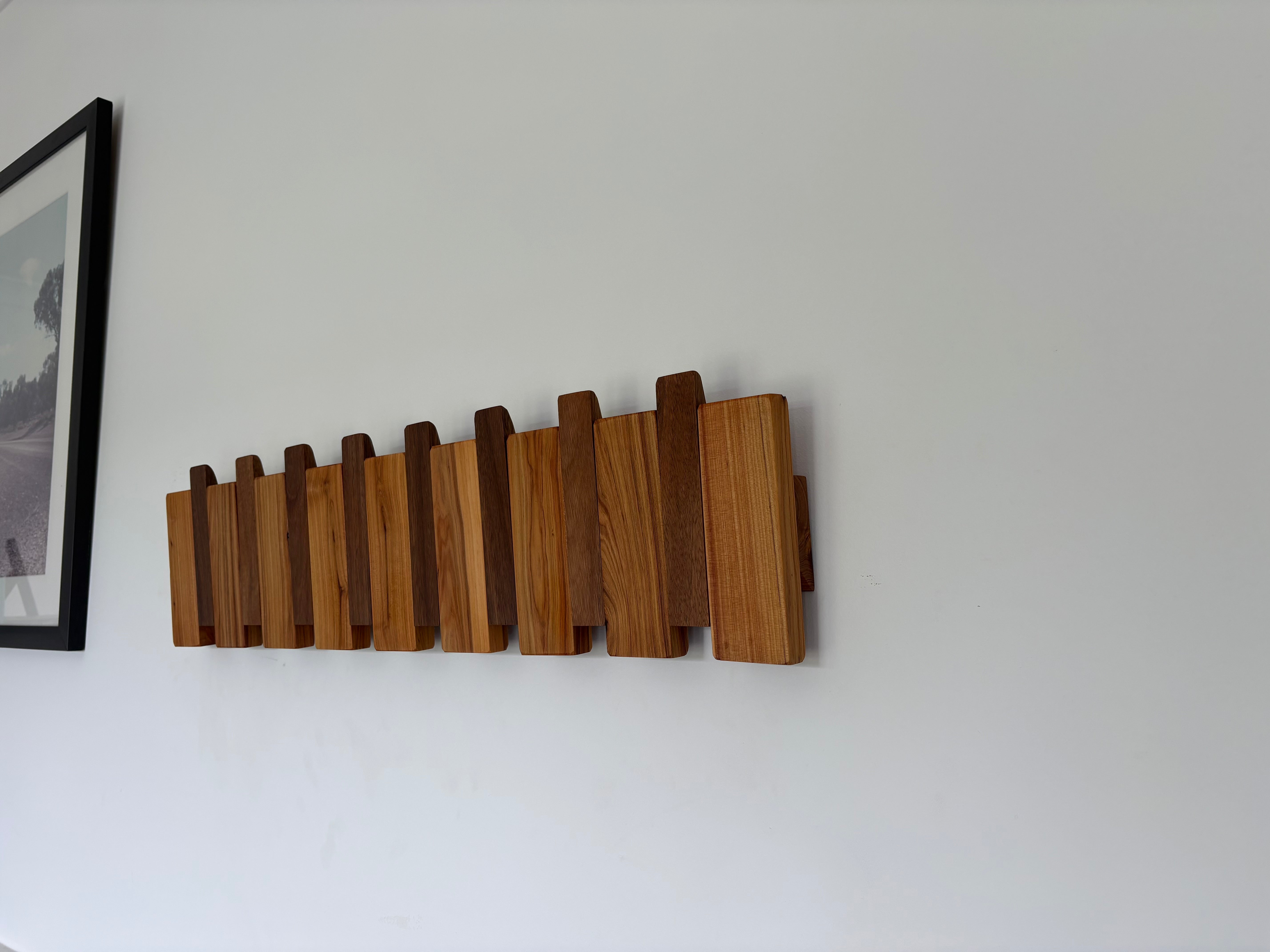 Two tone piano style coatrack