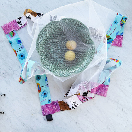 Birds and wombats weighted mesh food cover.