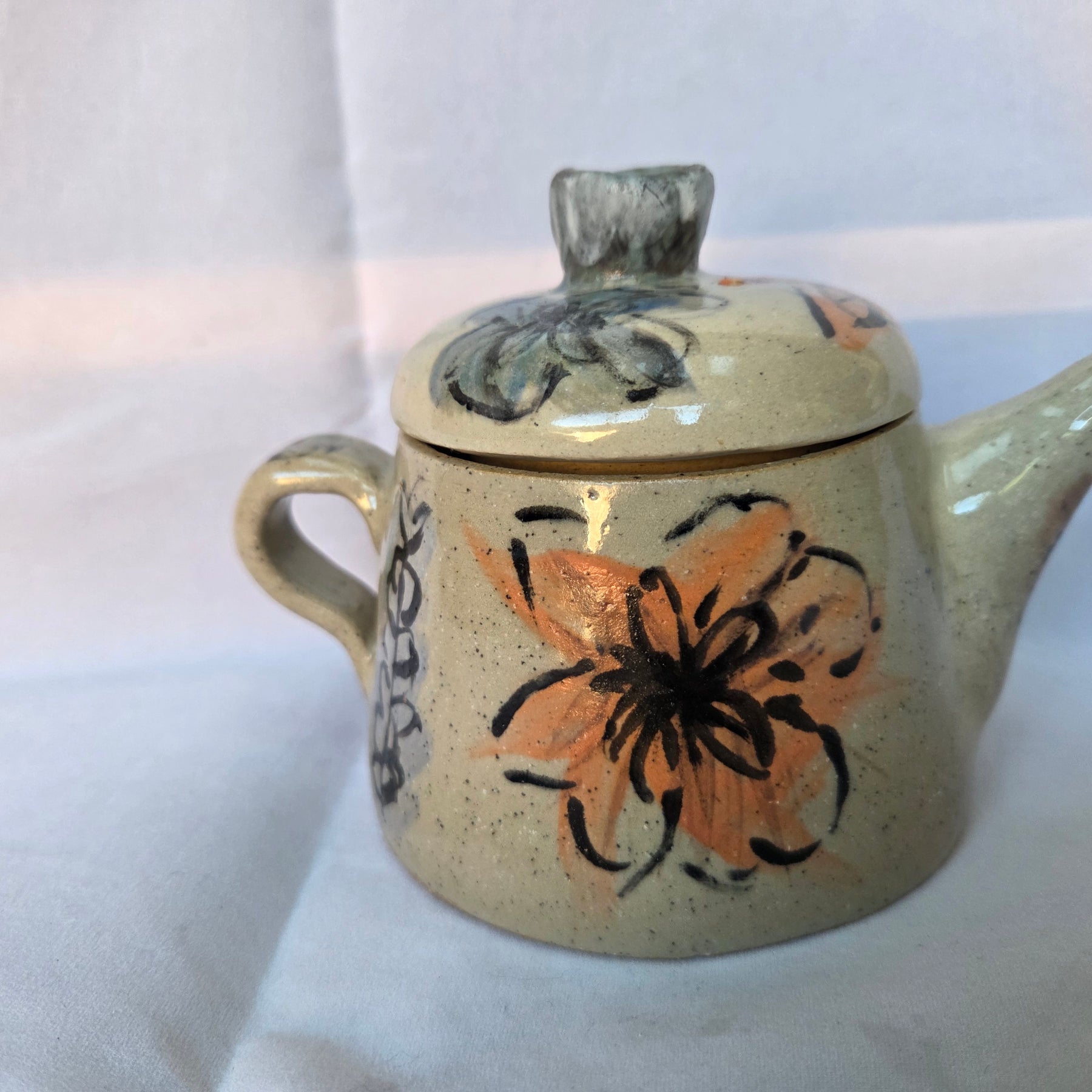 Small Japanese inspired ceramic One cup tea pot. Hand painted floral design. 10 x 9.5cm