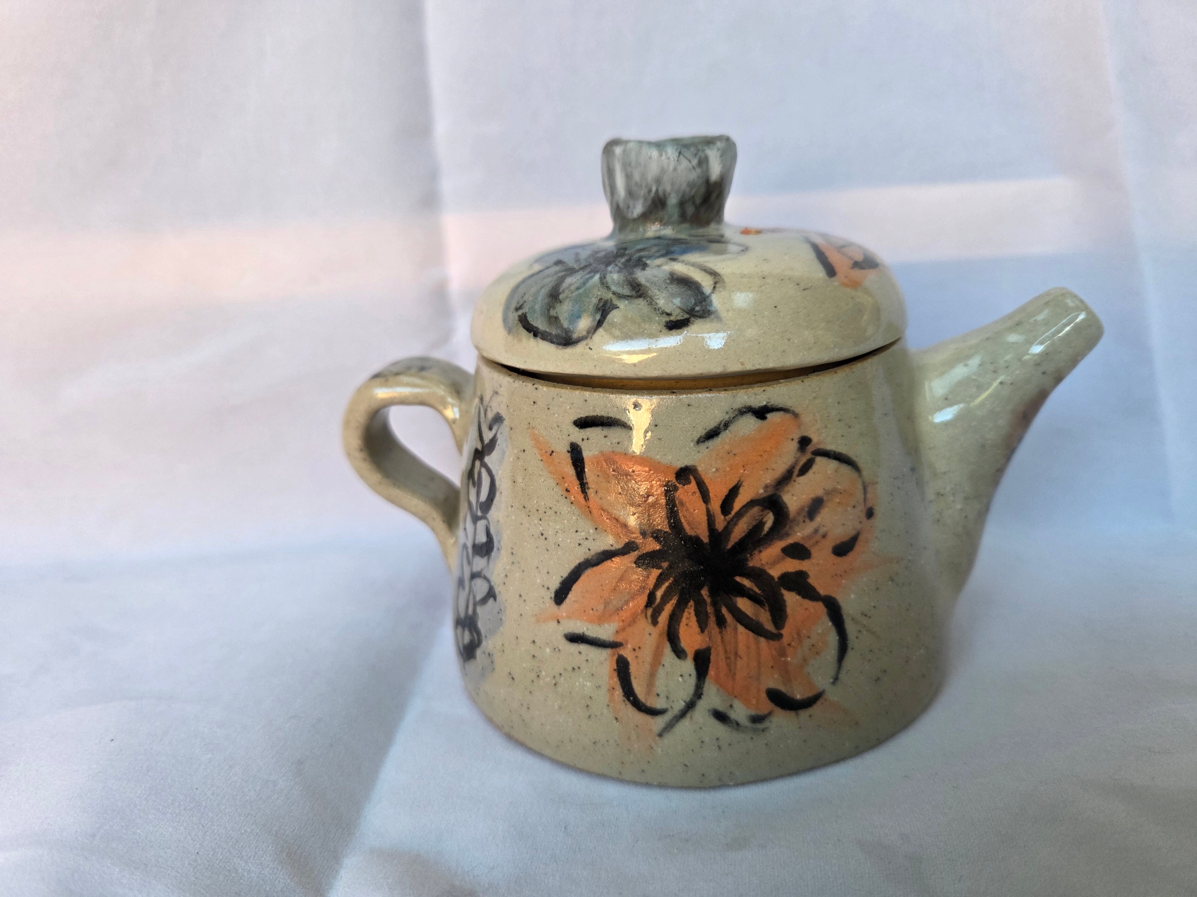 Small Japanese inspired ceramic One cup tea pot. Hand painted floral design. 10 x 9.5cm