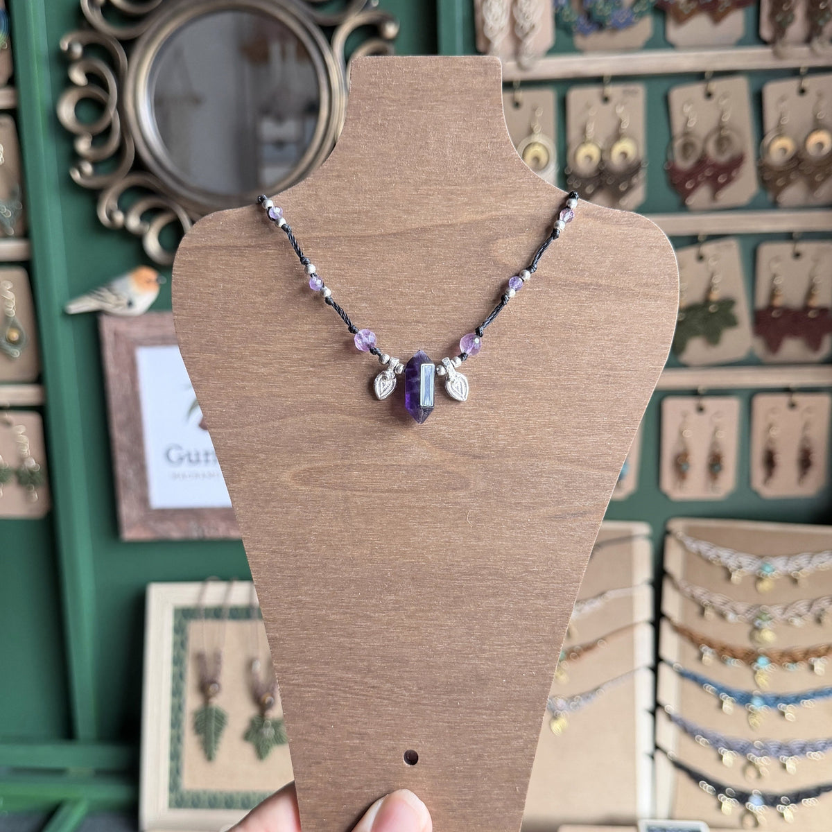 Crystal point necklace with faceted beads and solid brass charm