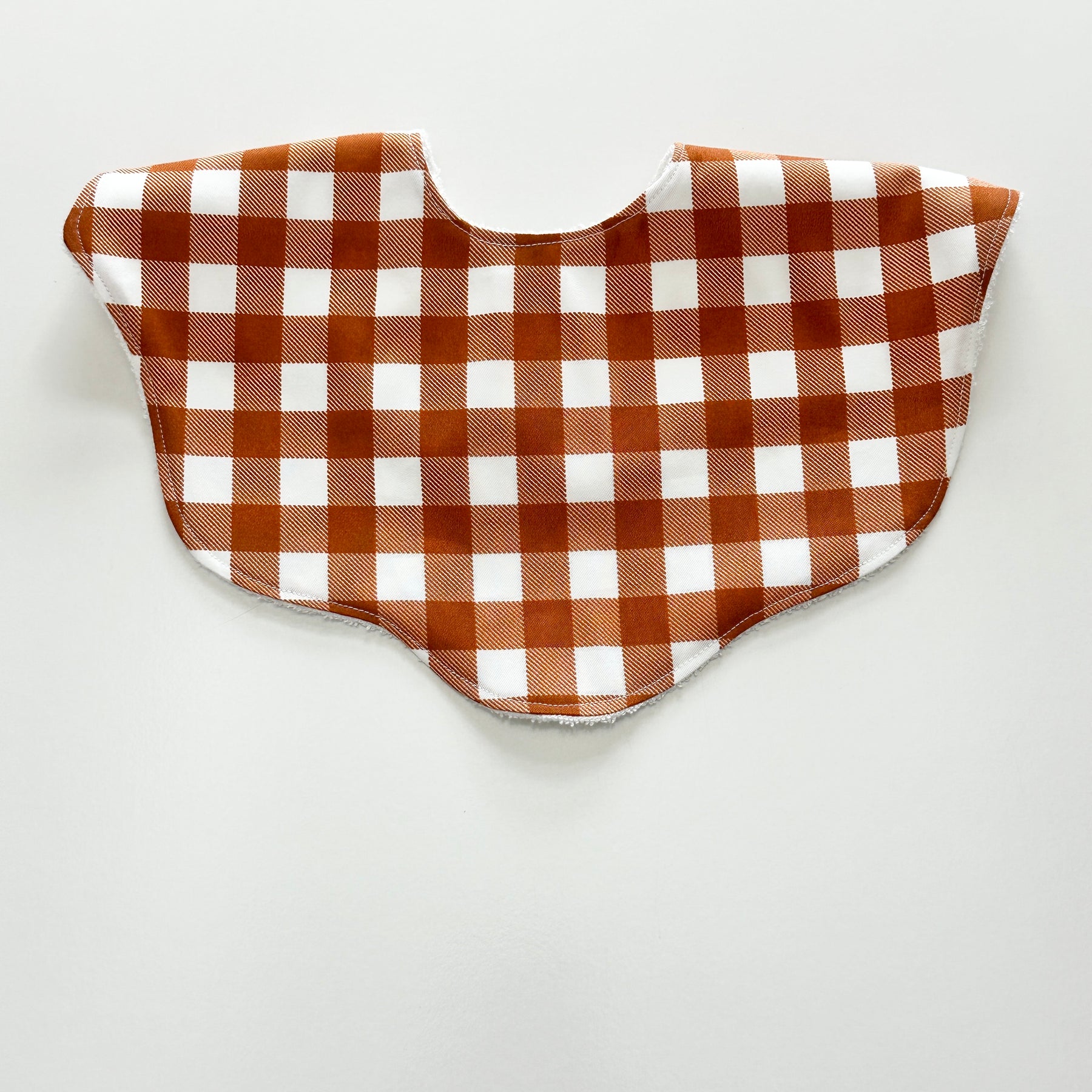 Rust gingham scalloped bib