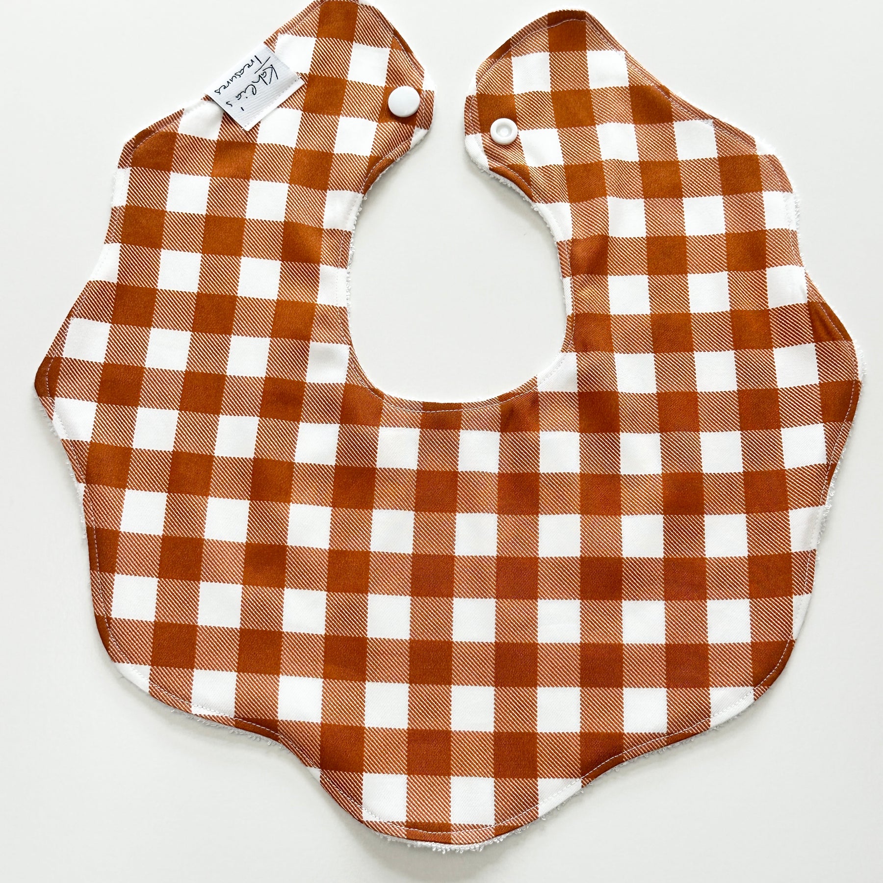 Rust gingham scalloped bib