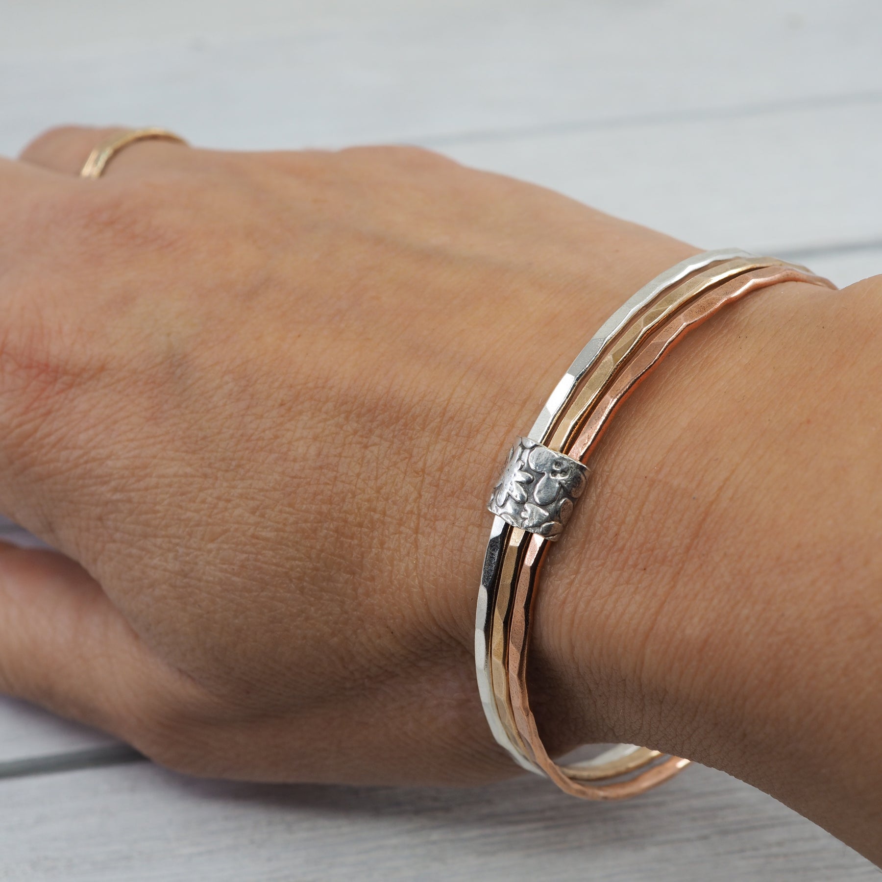 Silver, bronze and copper bangle set