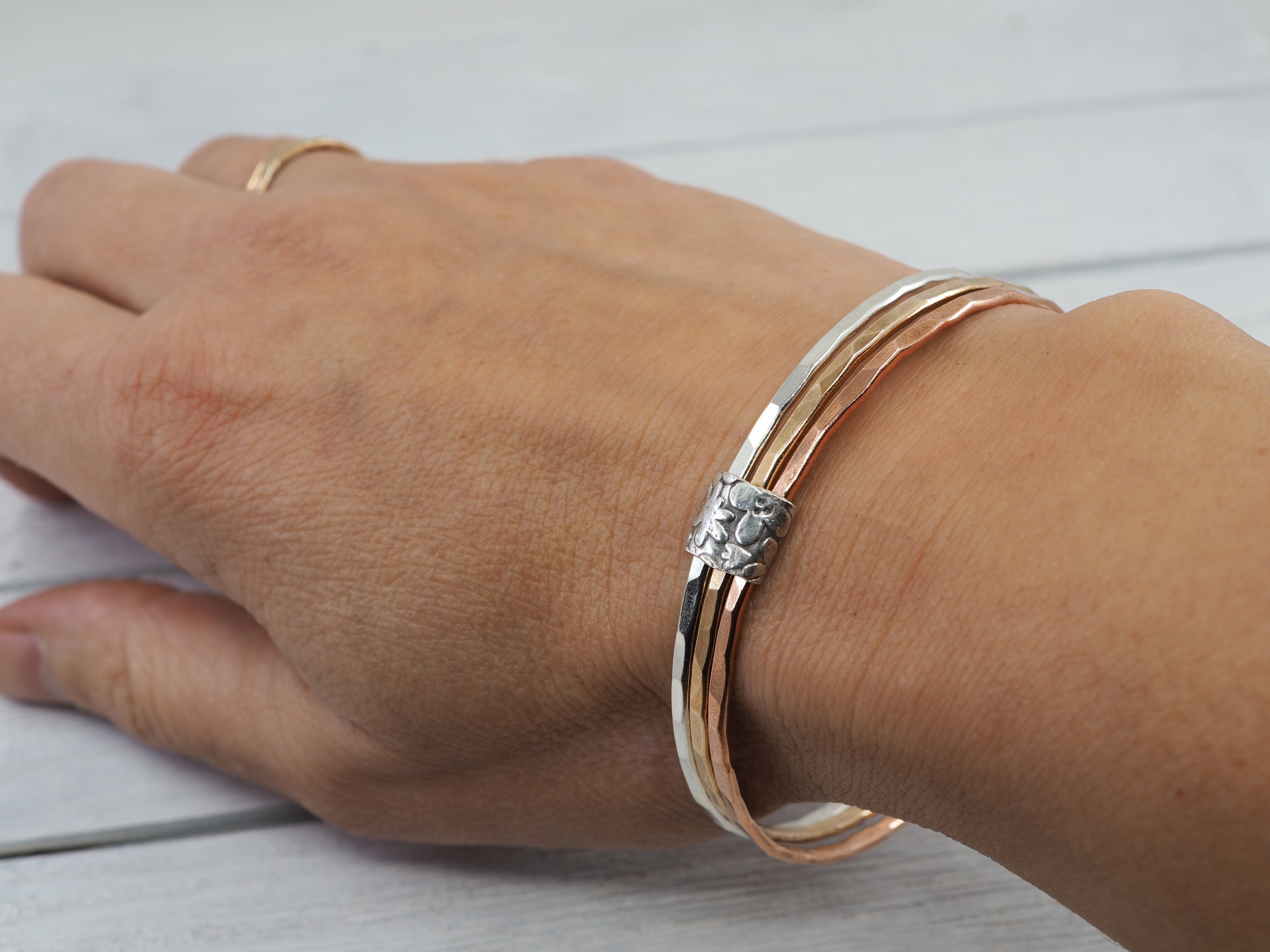 Silver, bronze and copper bangle set