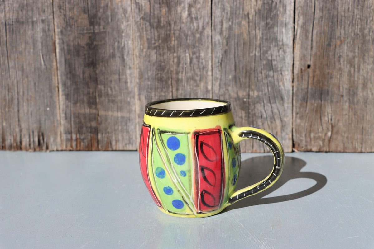 Hand-Painted Mug: Abstract yellow, red, green, black and blue mid-fire stoneware