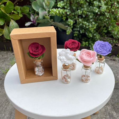 Minature flower in glass jar