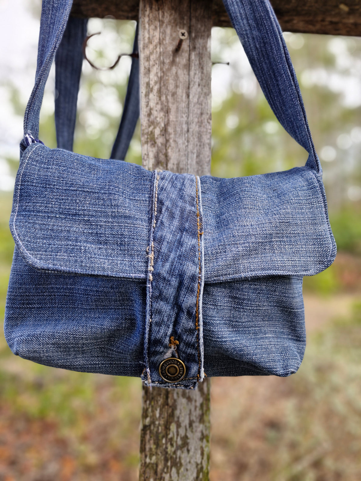 Give old denim a new life with this one-of-a-kind upcycled crossbody bag!
