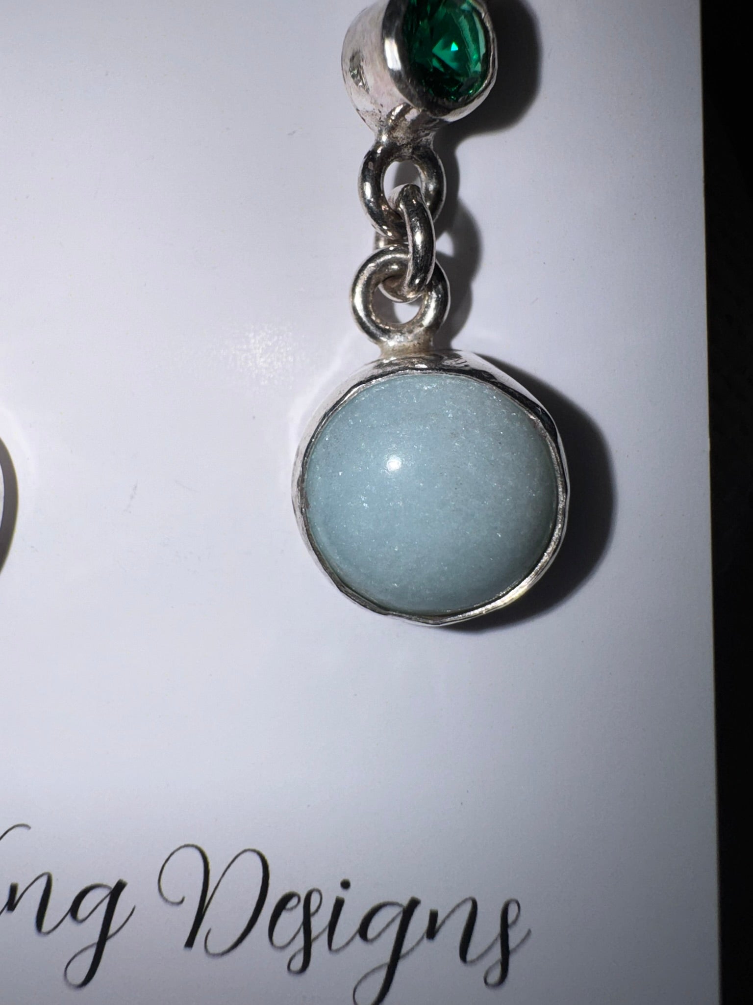 Sterling silver earrings featuring lab-created emeralds and amazonite