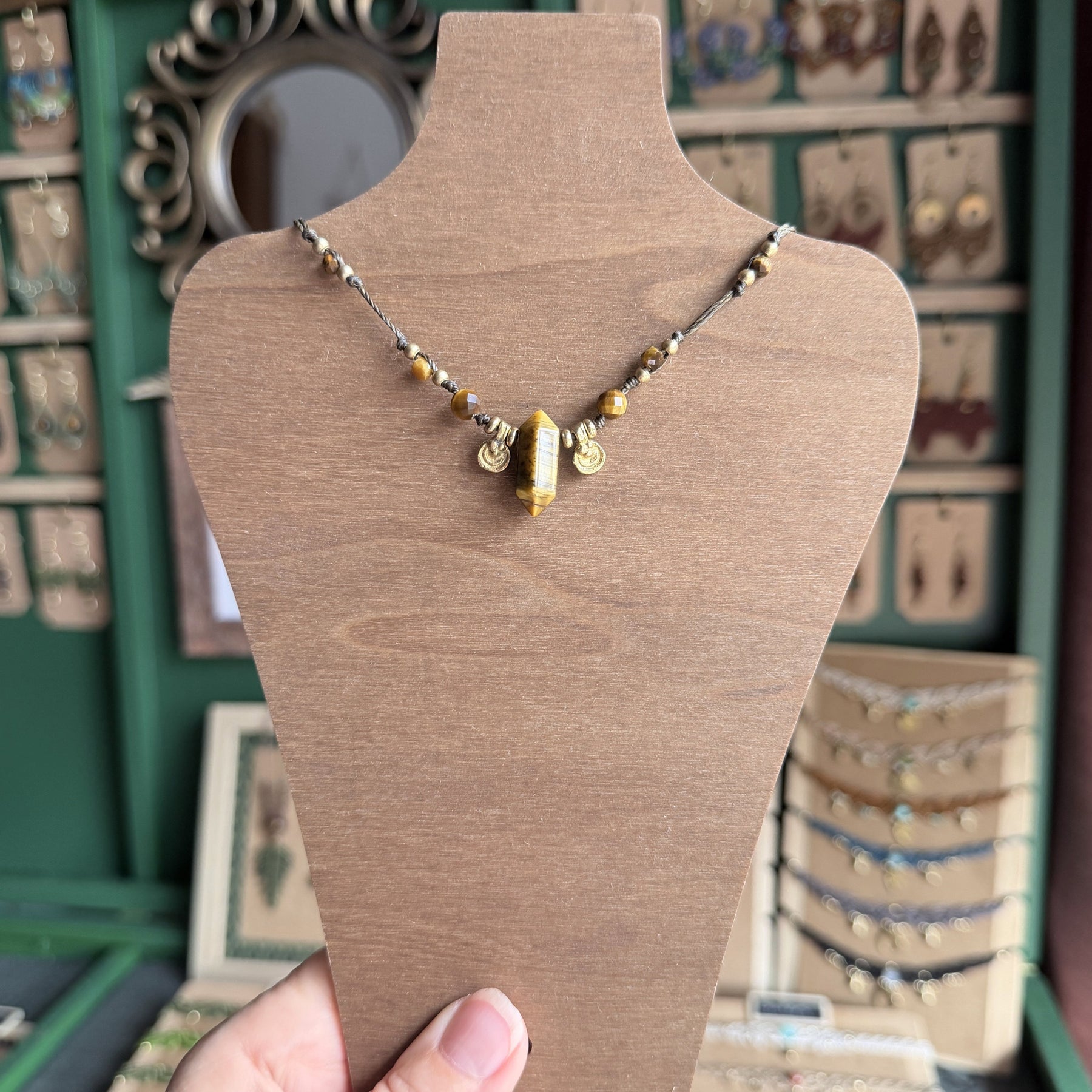 Crystal point necklace with faceted beads and solid brass charm
