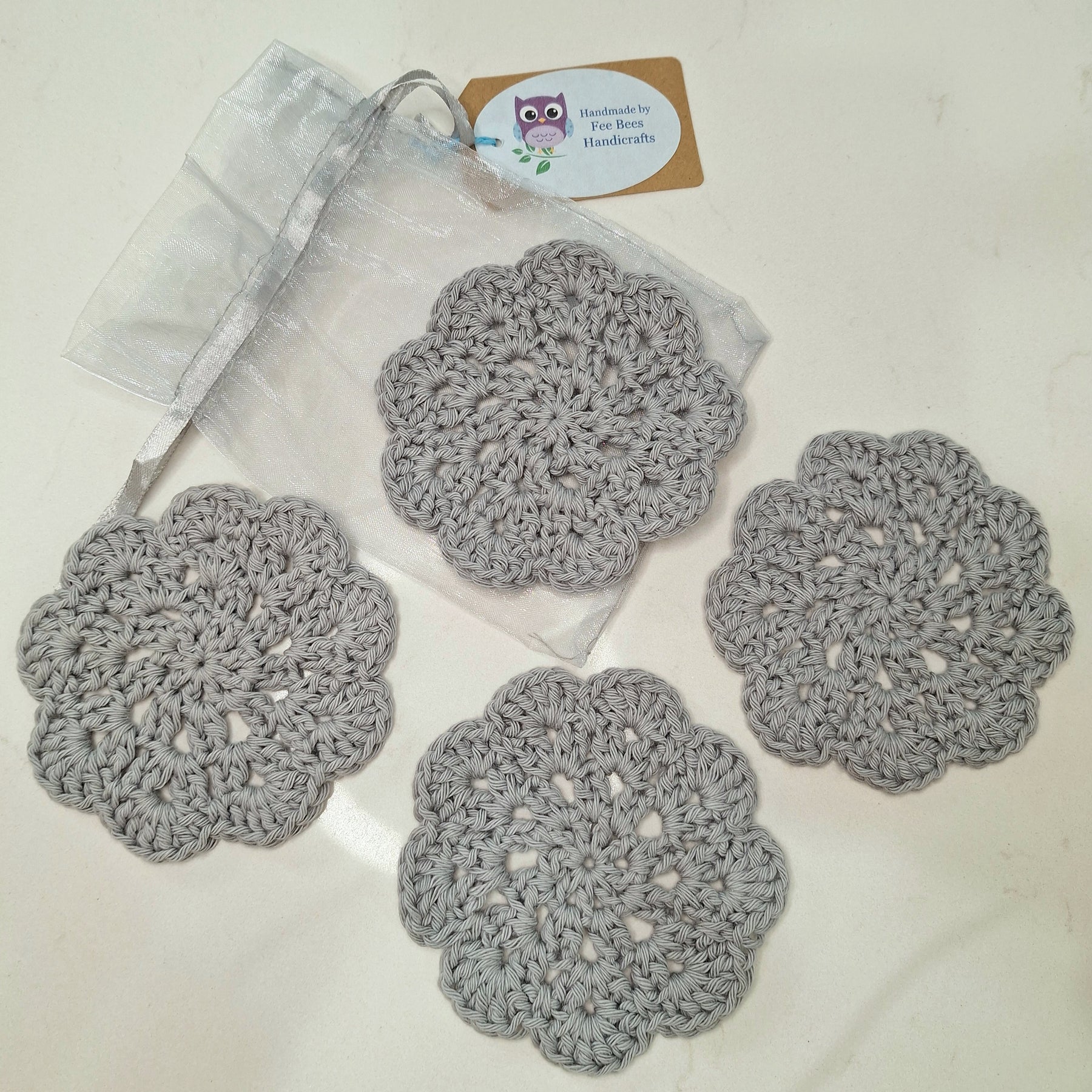 crocheted coasters Mandala style in a set of four