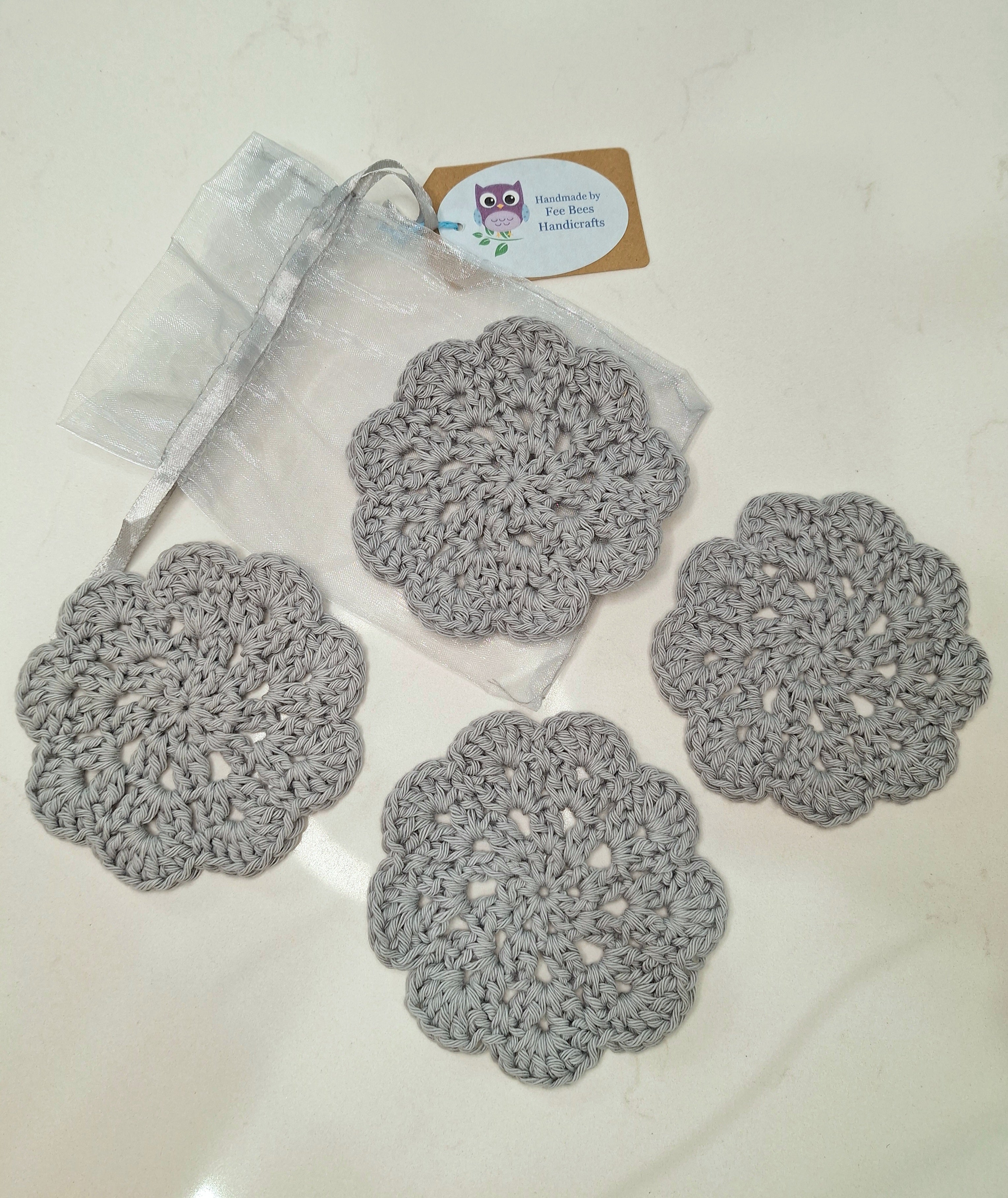 crocheted coasters Mandala style in a set of four
