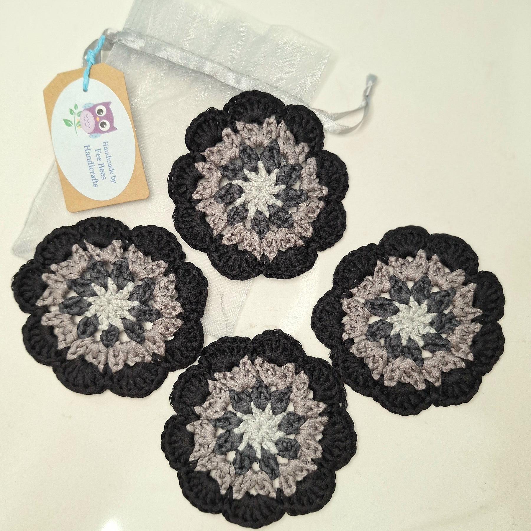 crocheted coasters Mandala style in a set of four
