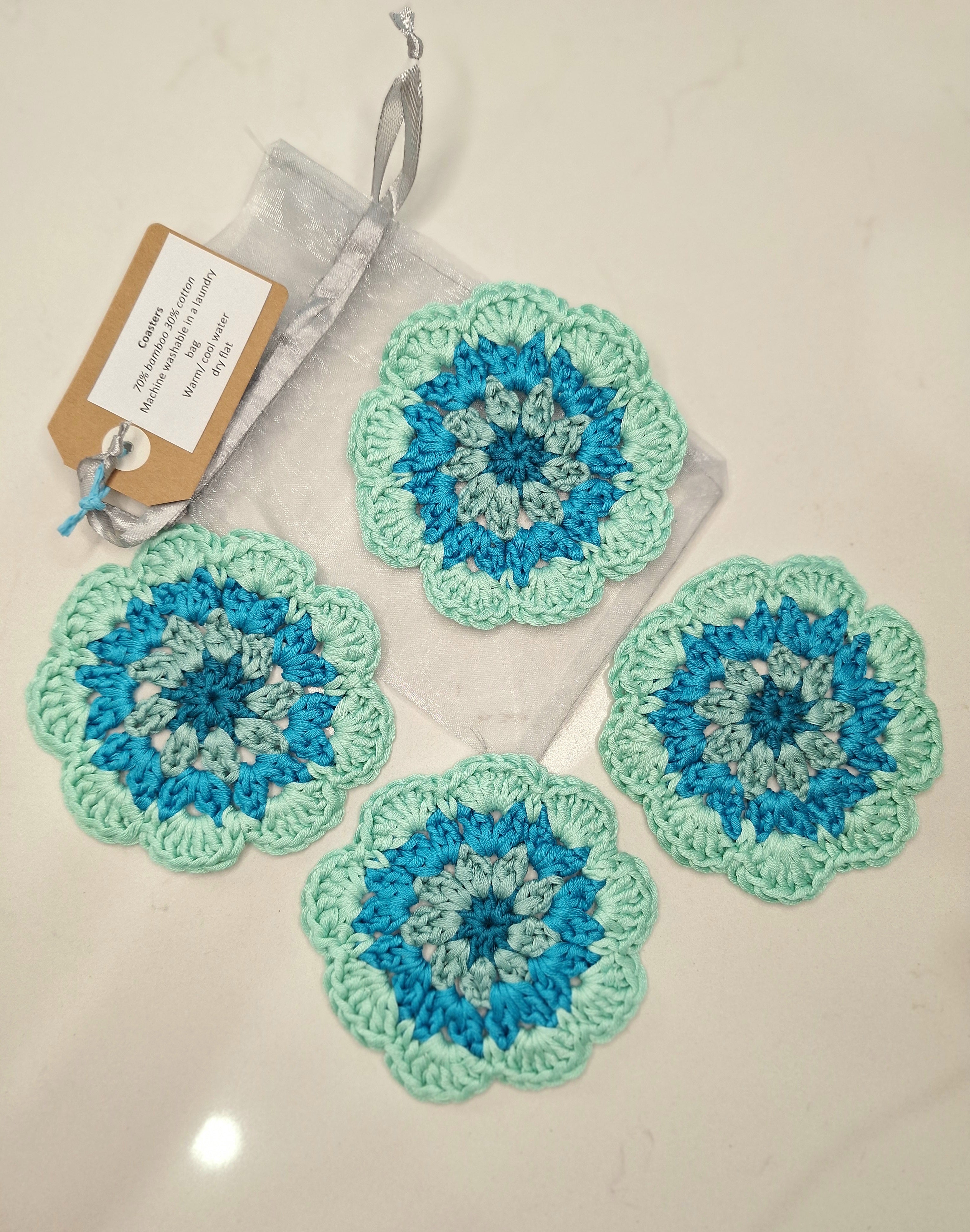 crocheted coasters Mandala style in a set of four