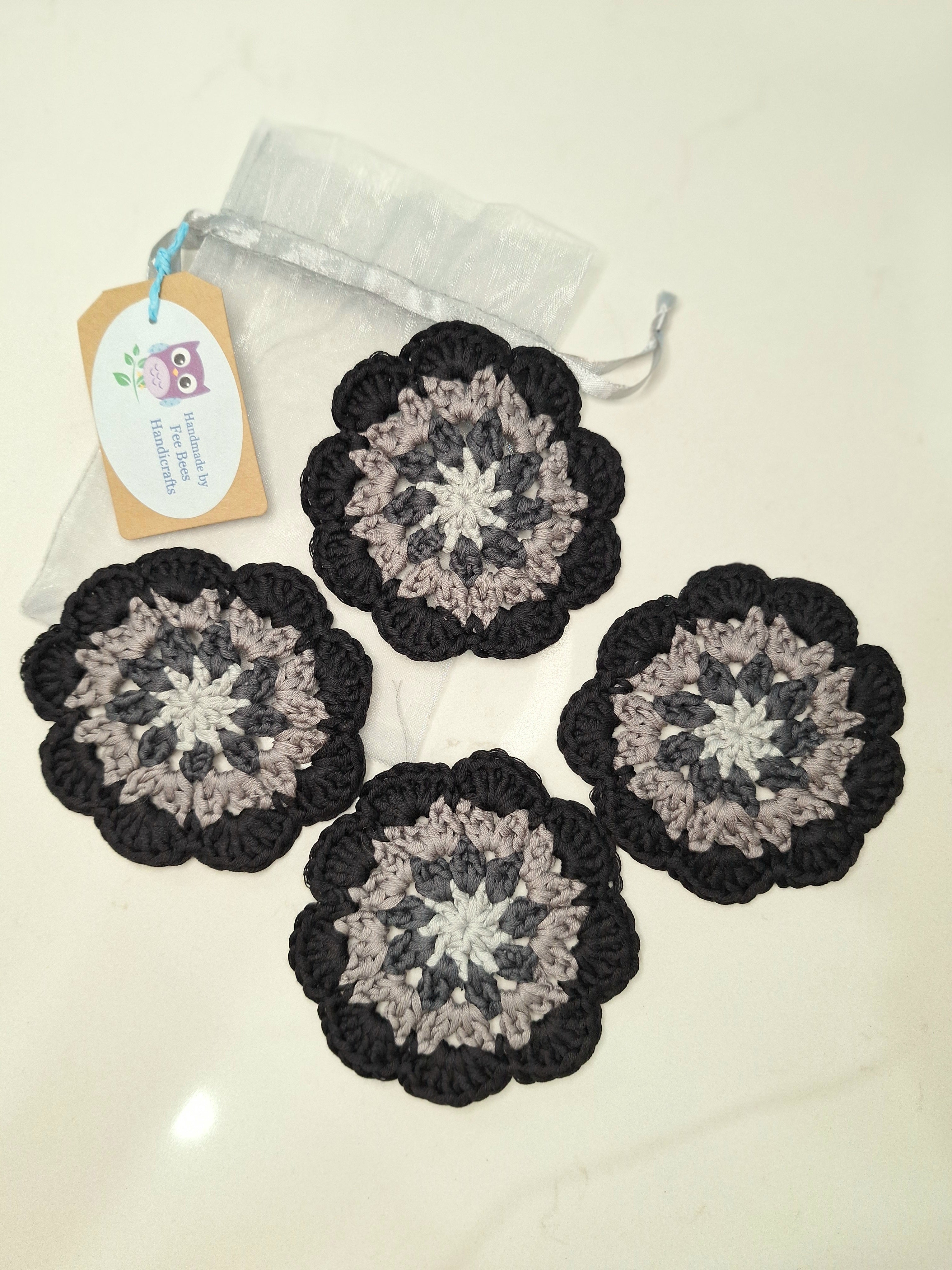 crocheted coasters Mandala style in a set of four