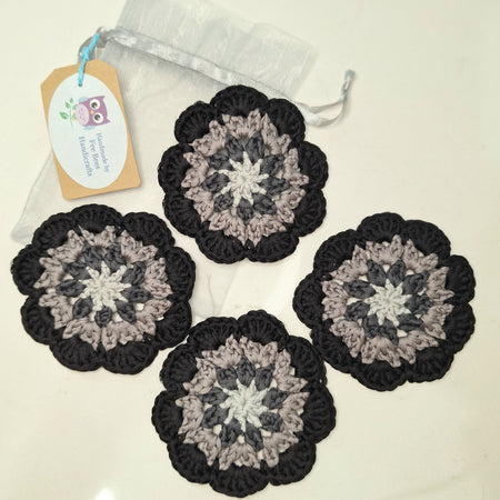 crocheted coasters Mandala style in a set of four