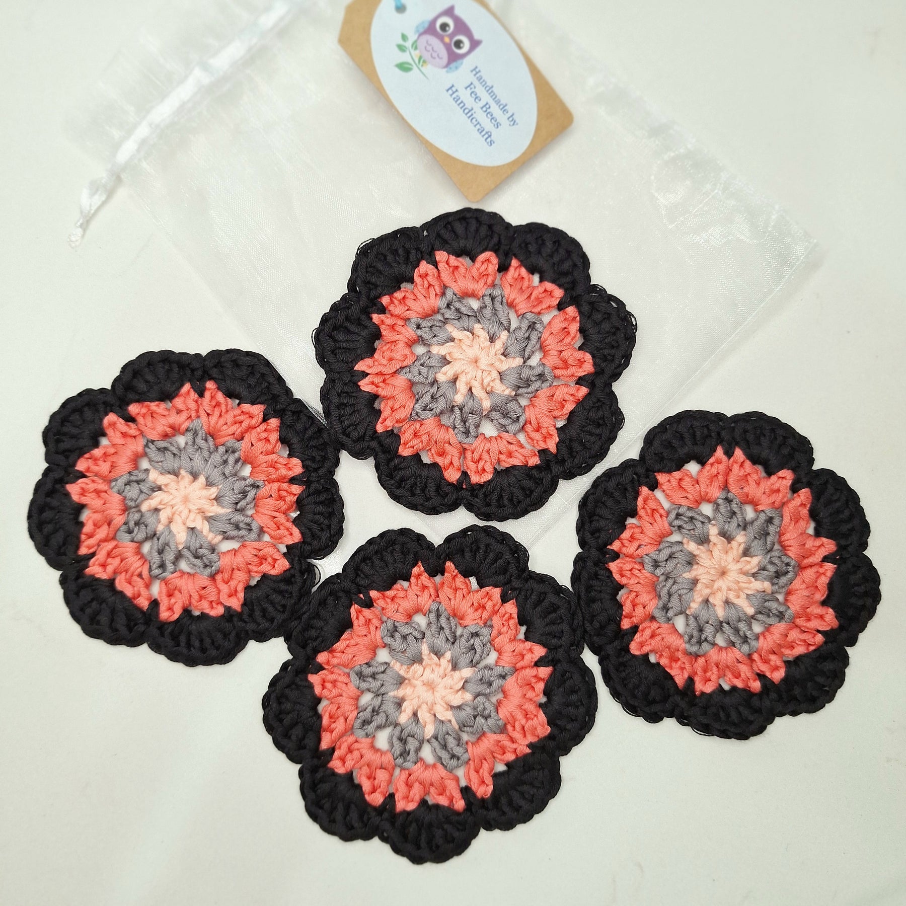 crocheted coasters Mandala style in a set of four