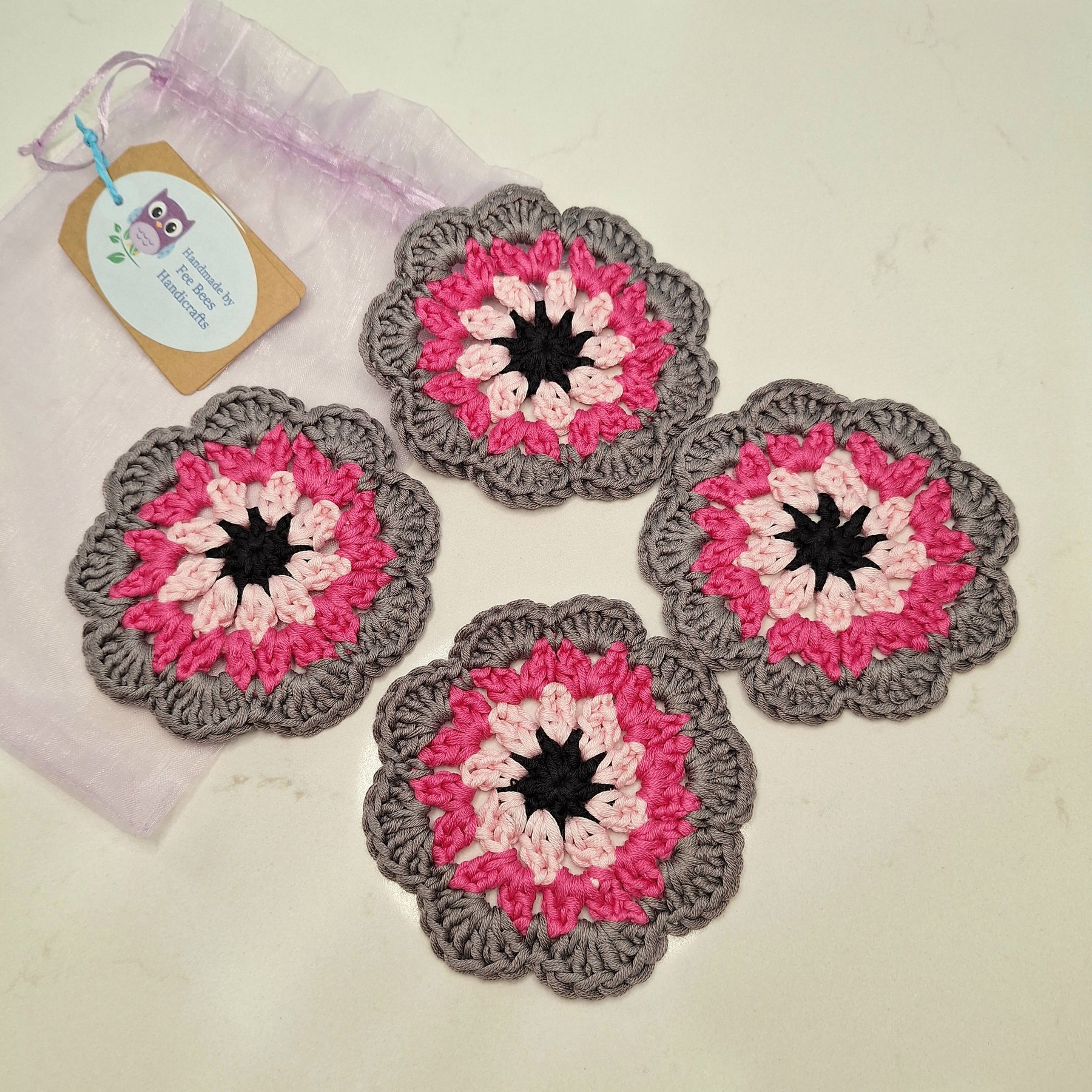 crocheted coasters Mandala style in a set of four