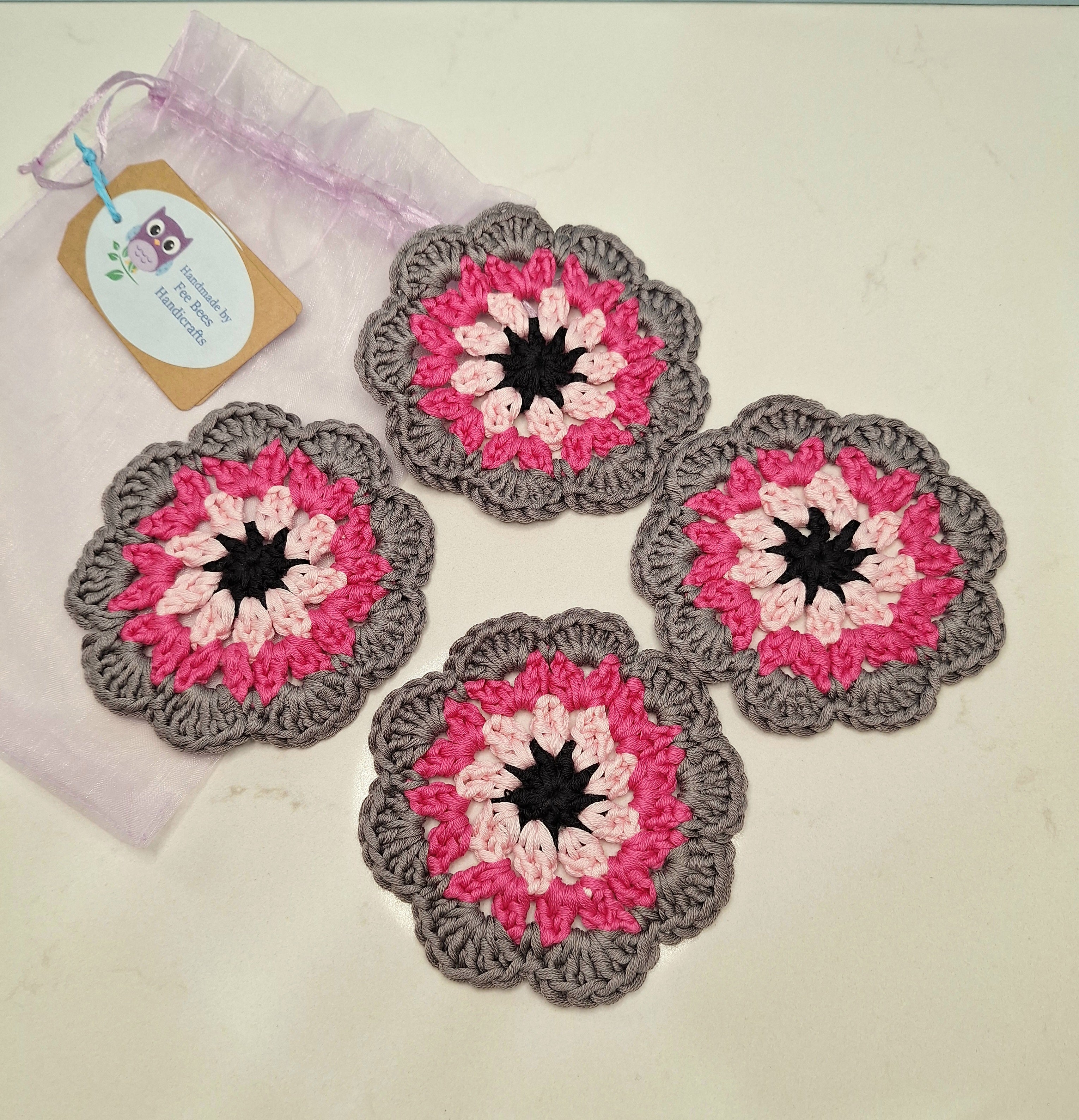crocheted coasters Mandala style in a set of four