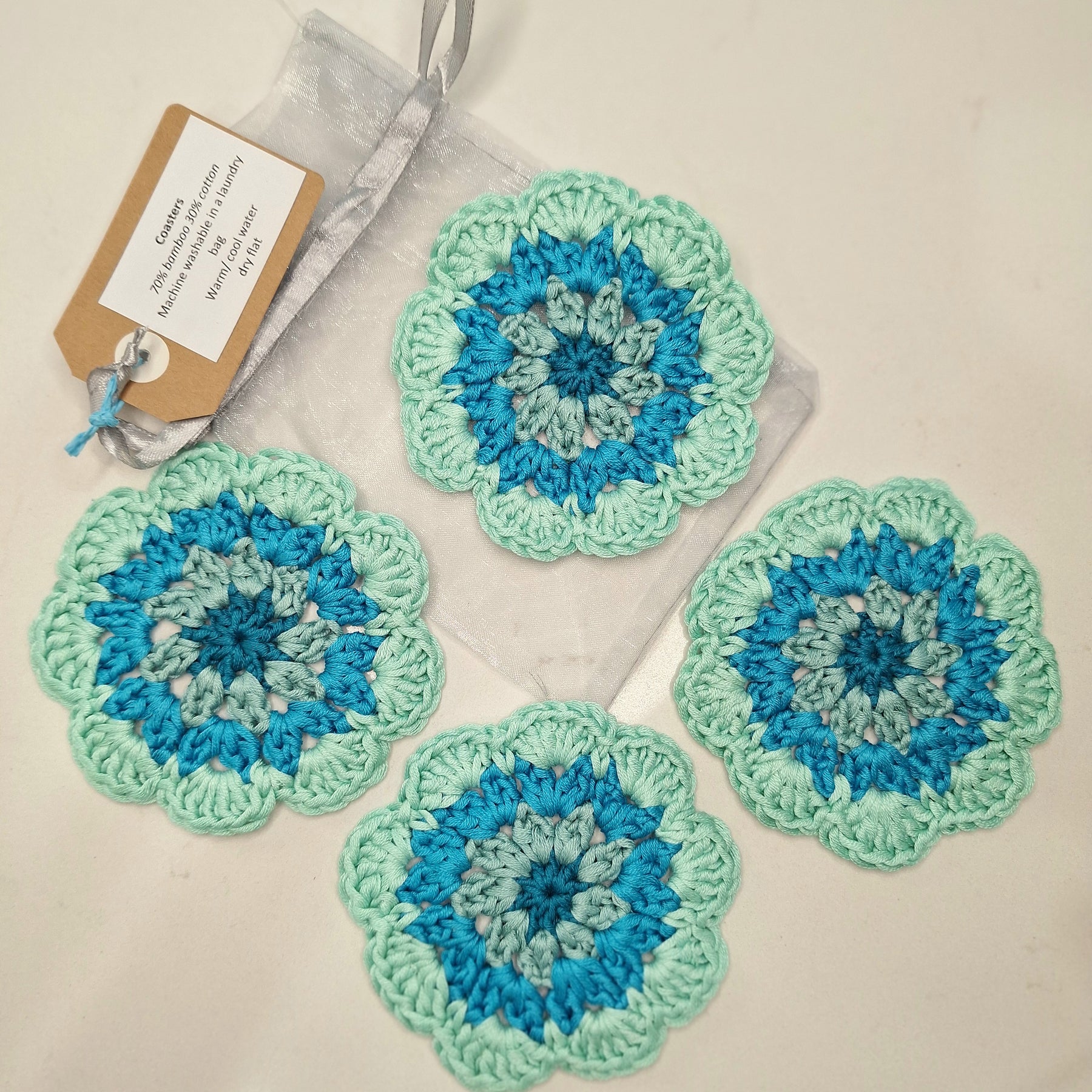 crocheted coasters Mandala style in a set of four