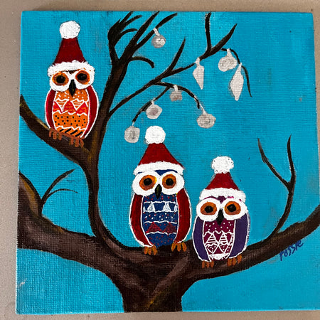 Owls in christmas hats