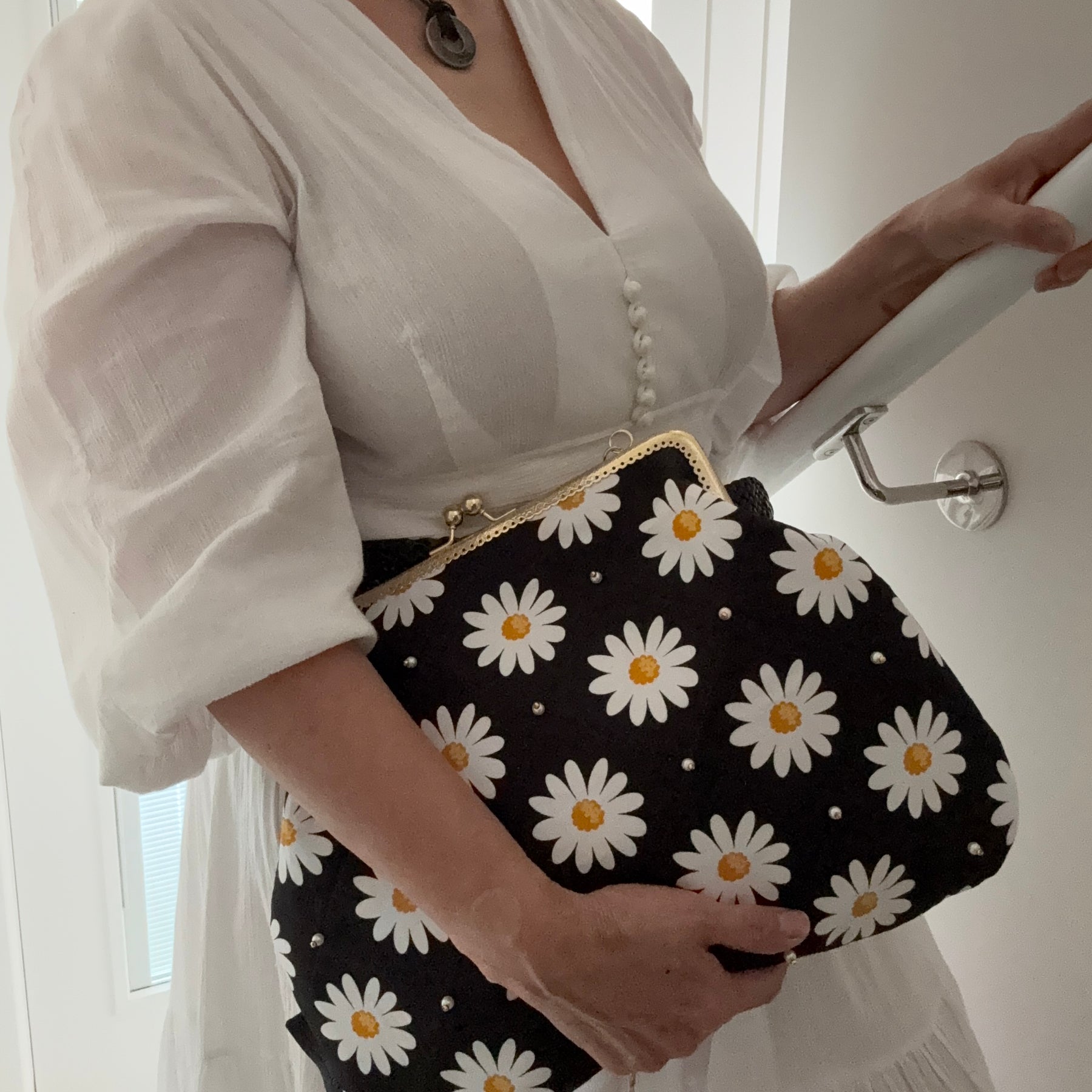 ‘Field of daisies’ metal frame purse