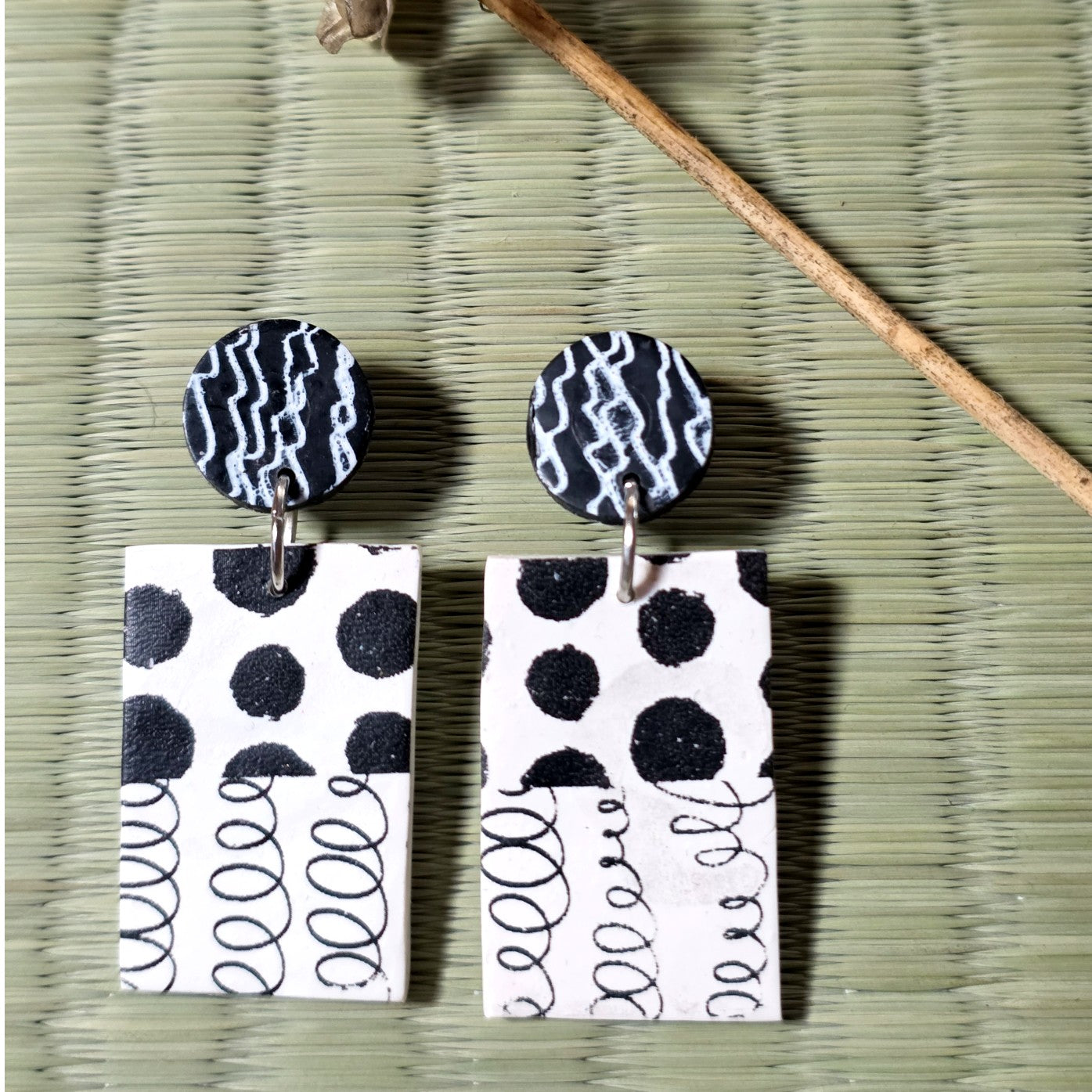 Black and white stud earrings