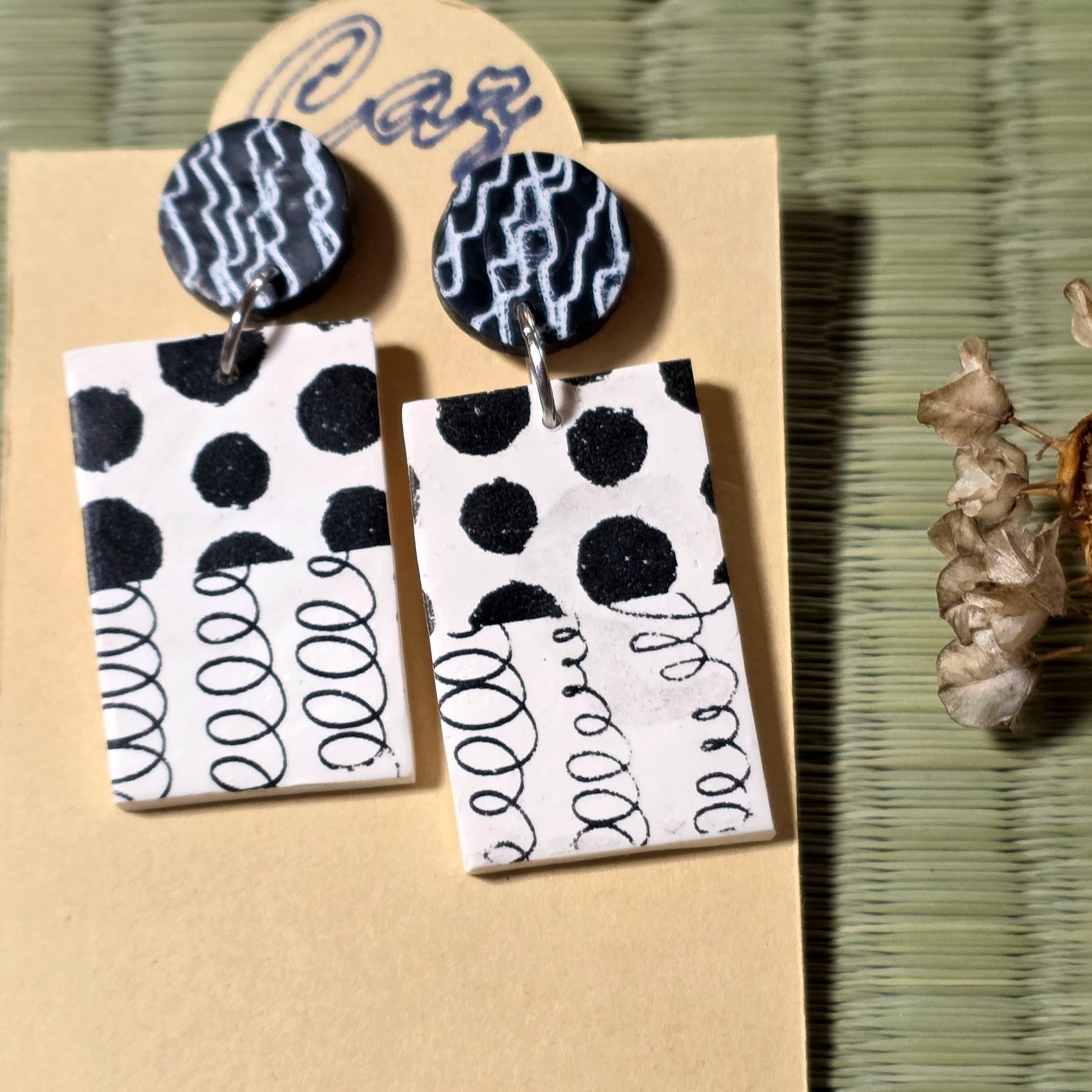Black and white stud earrings