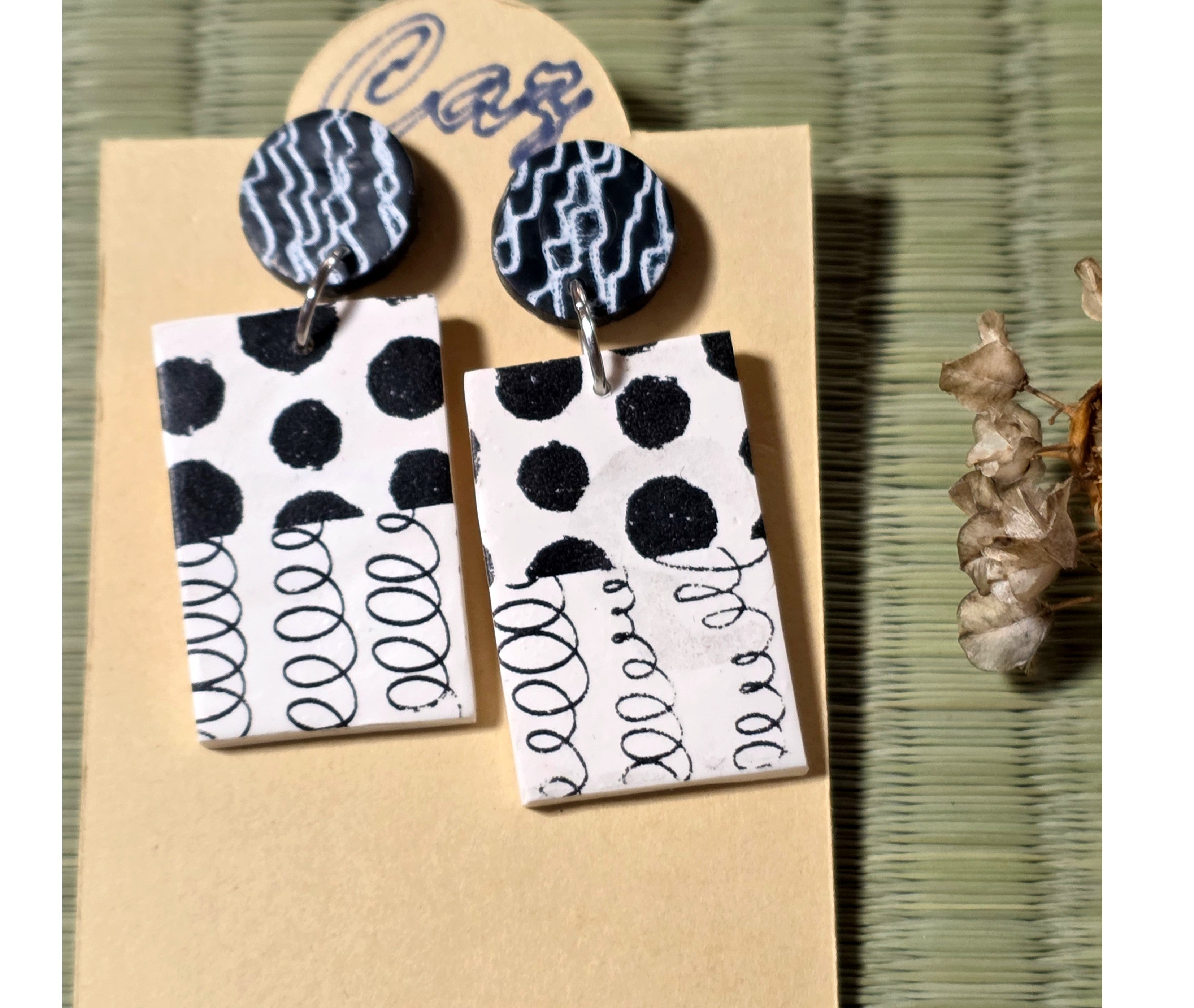 Black and white stud earrings