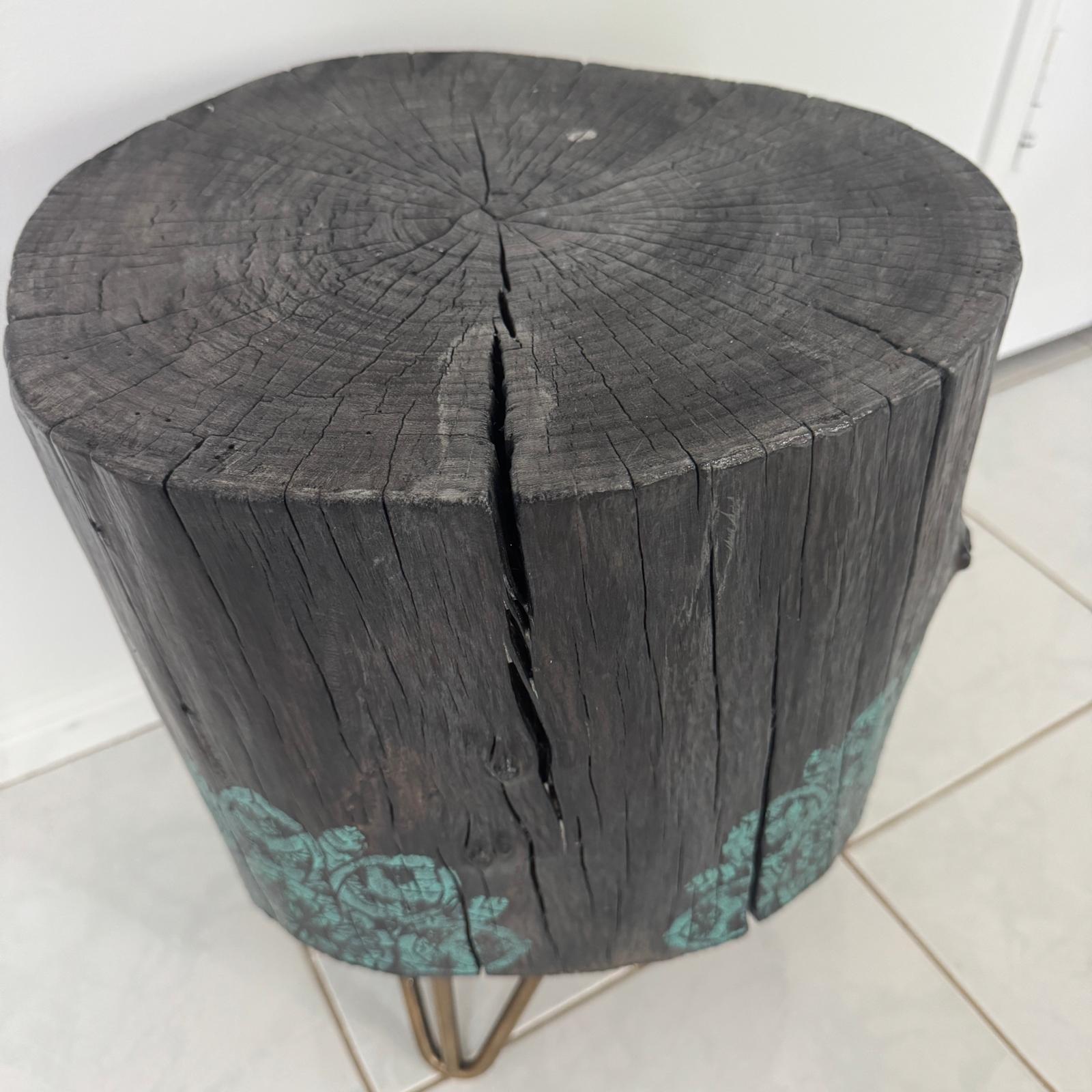 Timber stump table featuring teal mandala hand-painted artwork