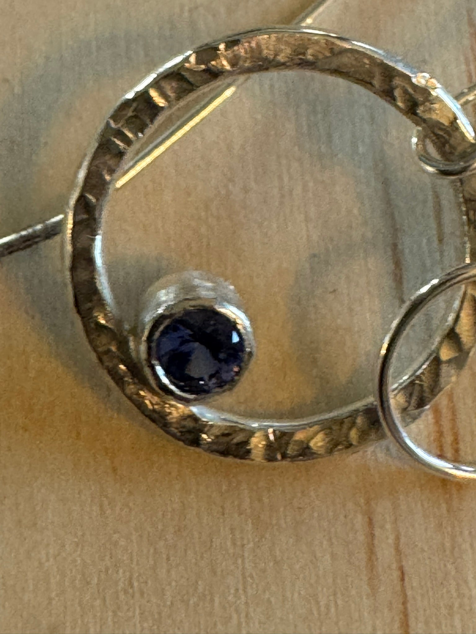 Dazzling iolite circle hammered earrings