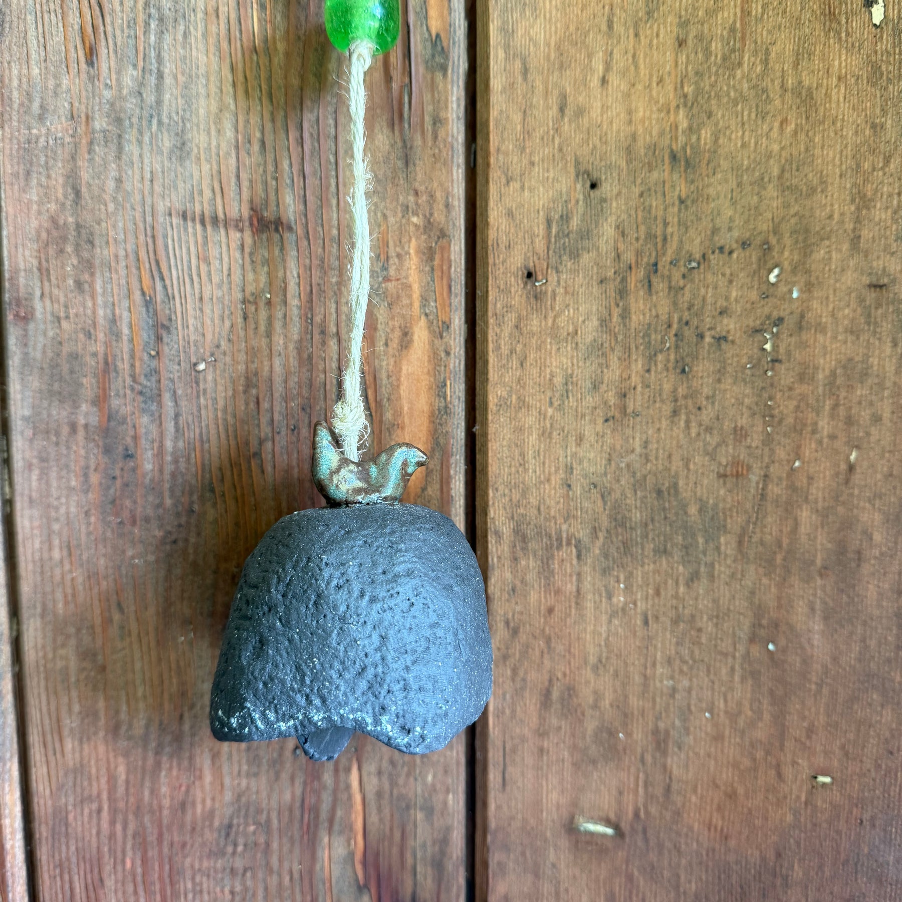 Rustic bell with bird