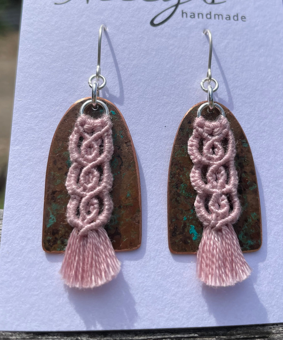 Pink macrame thread on patinated copper